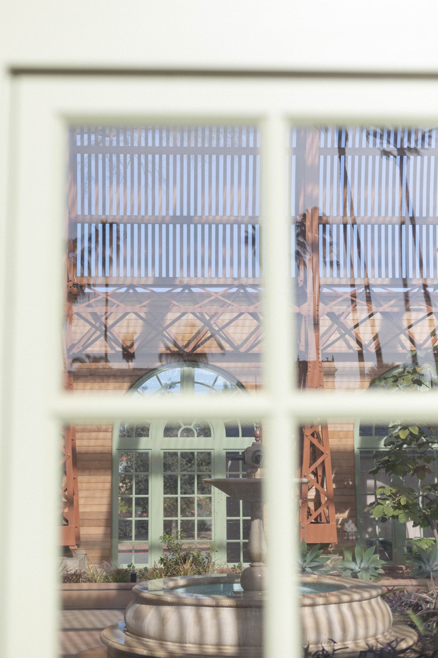 photo of window showing the inside of Balboa Park's Botanical Building in San Diego California.