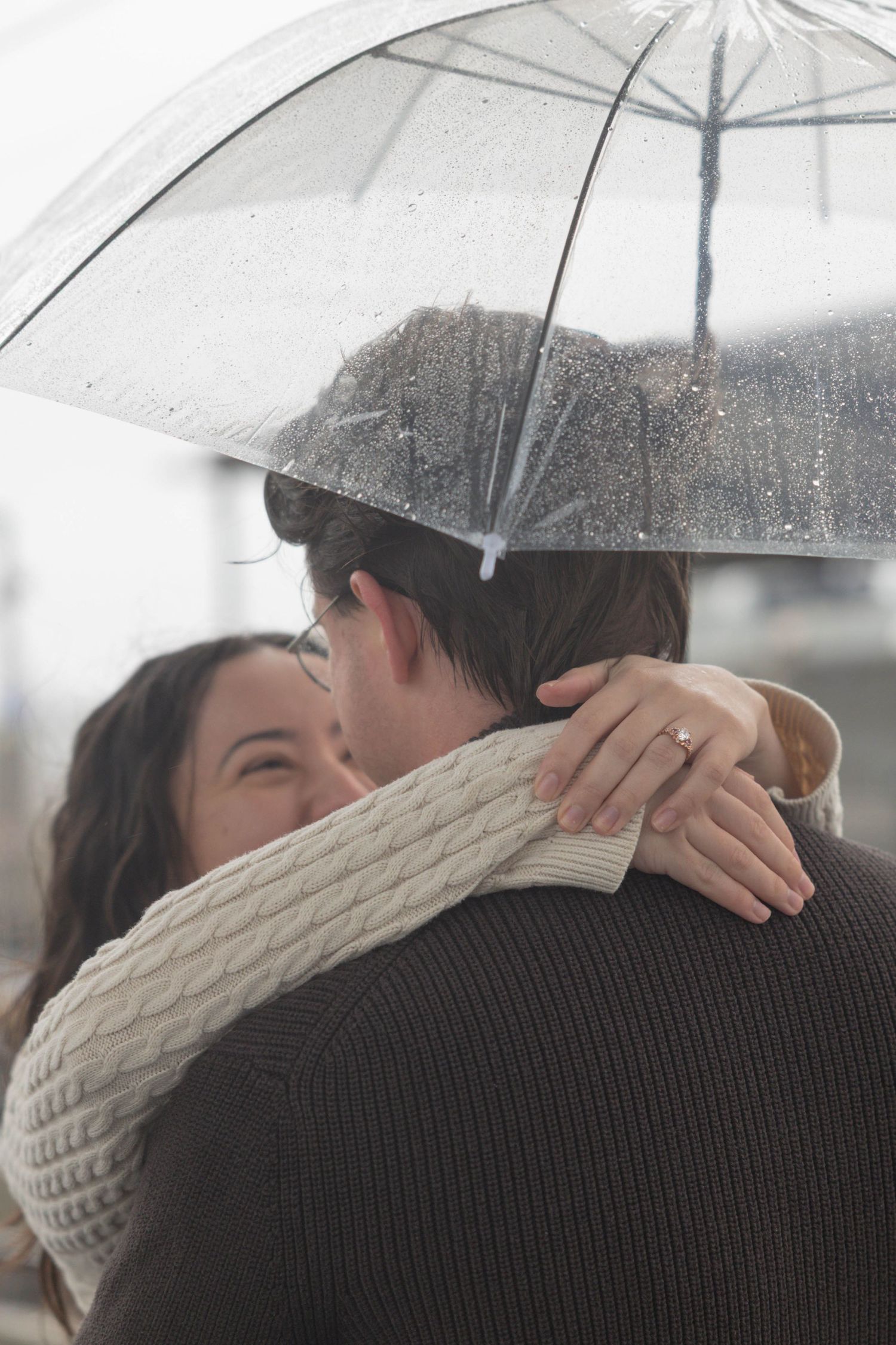 couple embracing in the rain.