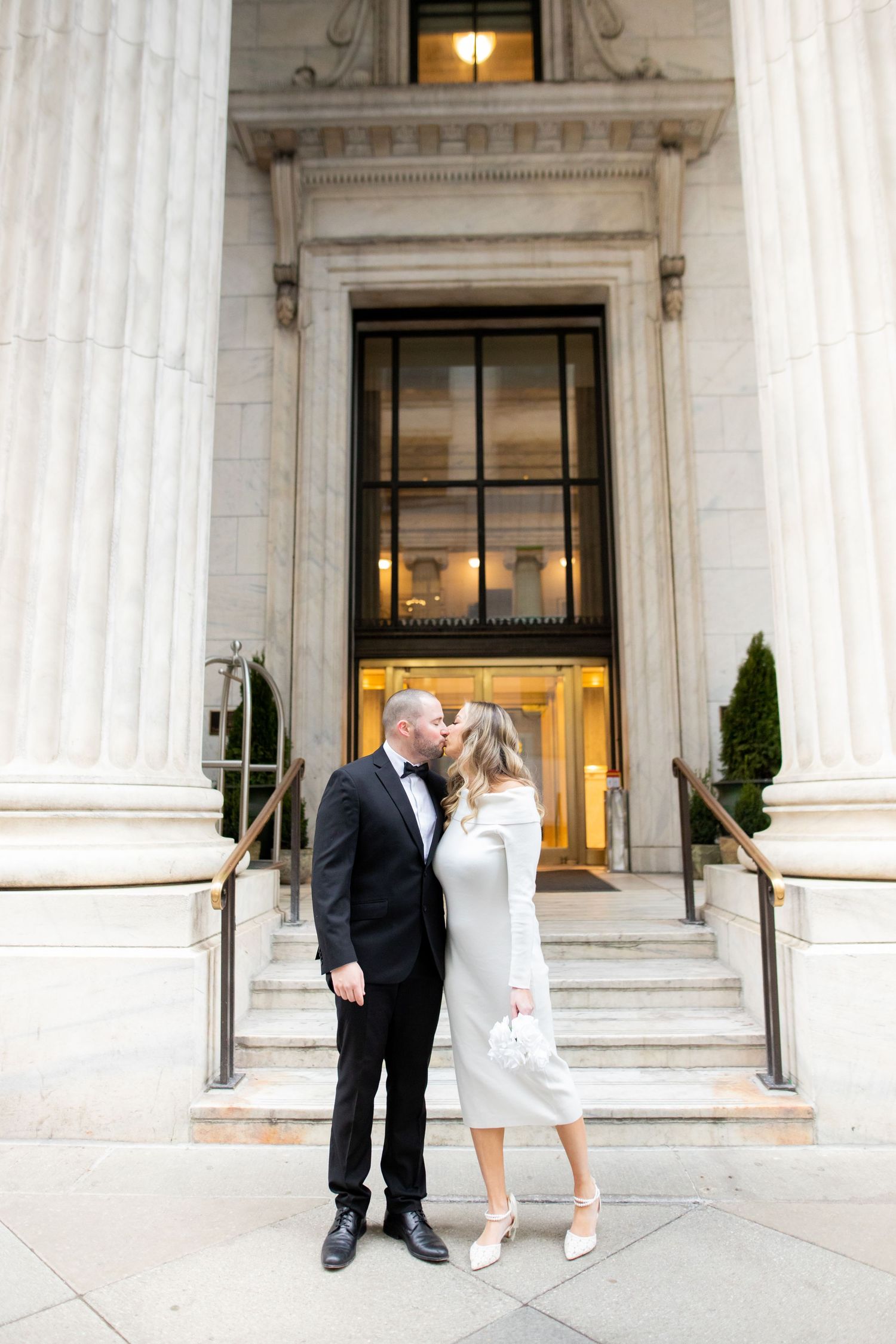 Three wedding photos at a grand white marble building entrance with elegant columns and architectural details.