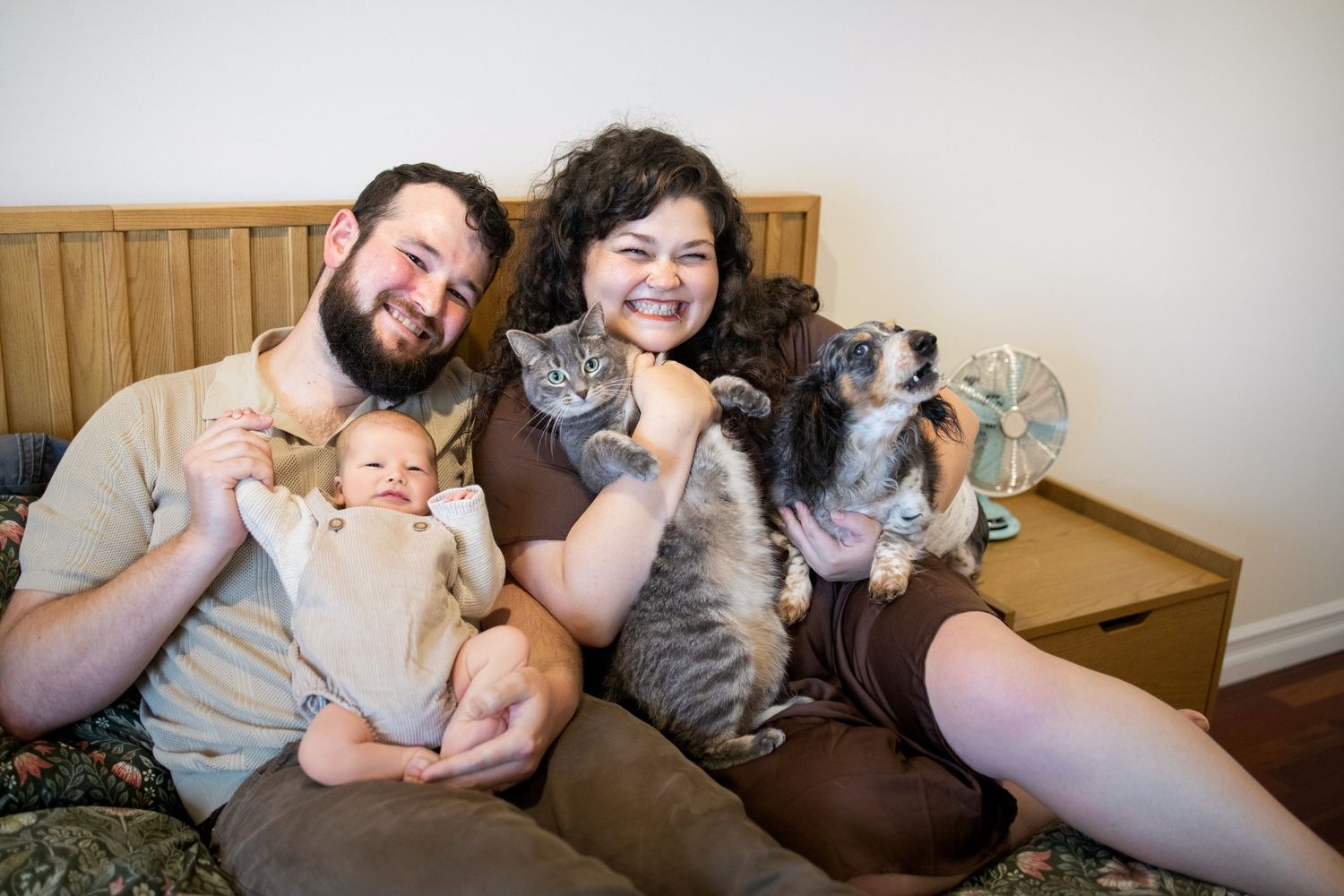 Two cats and their humans cuddle together on a couch in a series of candid family photos.