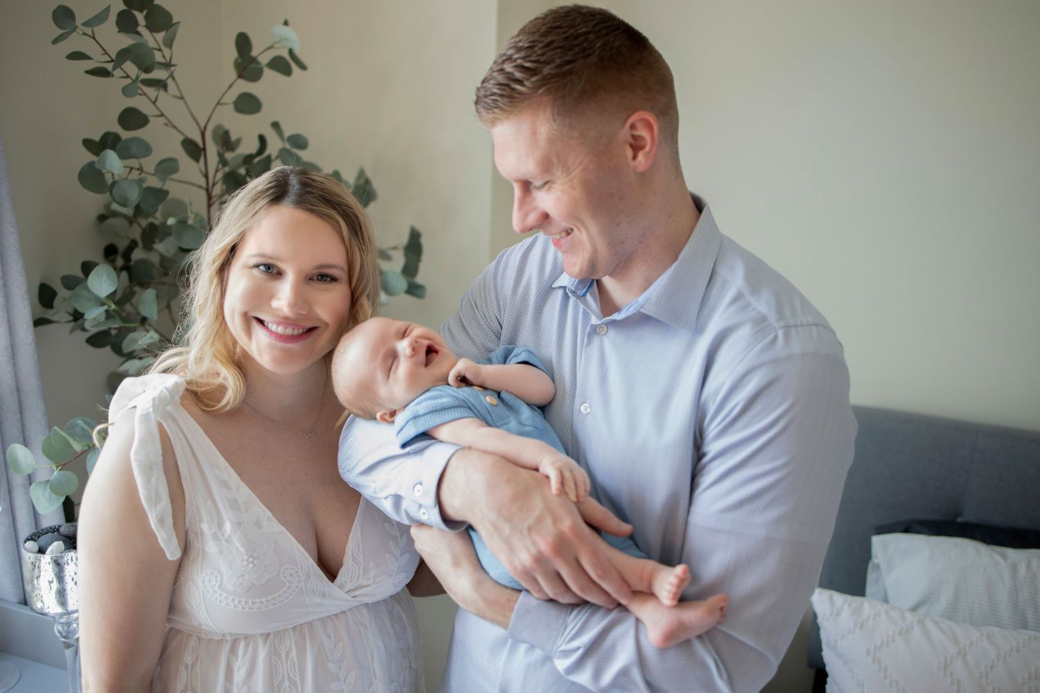 A series of tender moments between people with a newborn baby in a bright, airy room with plants.