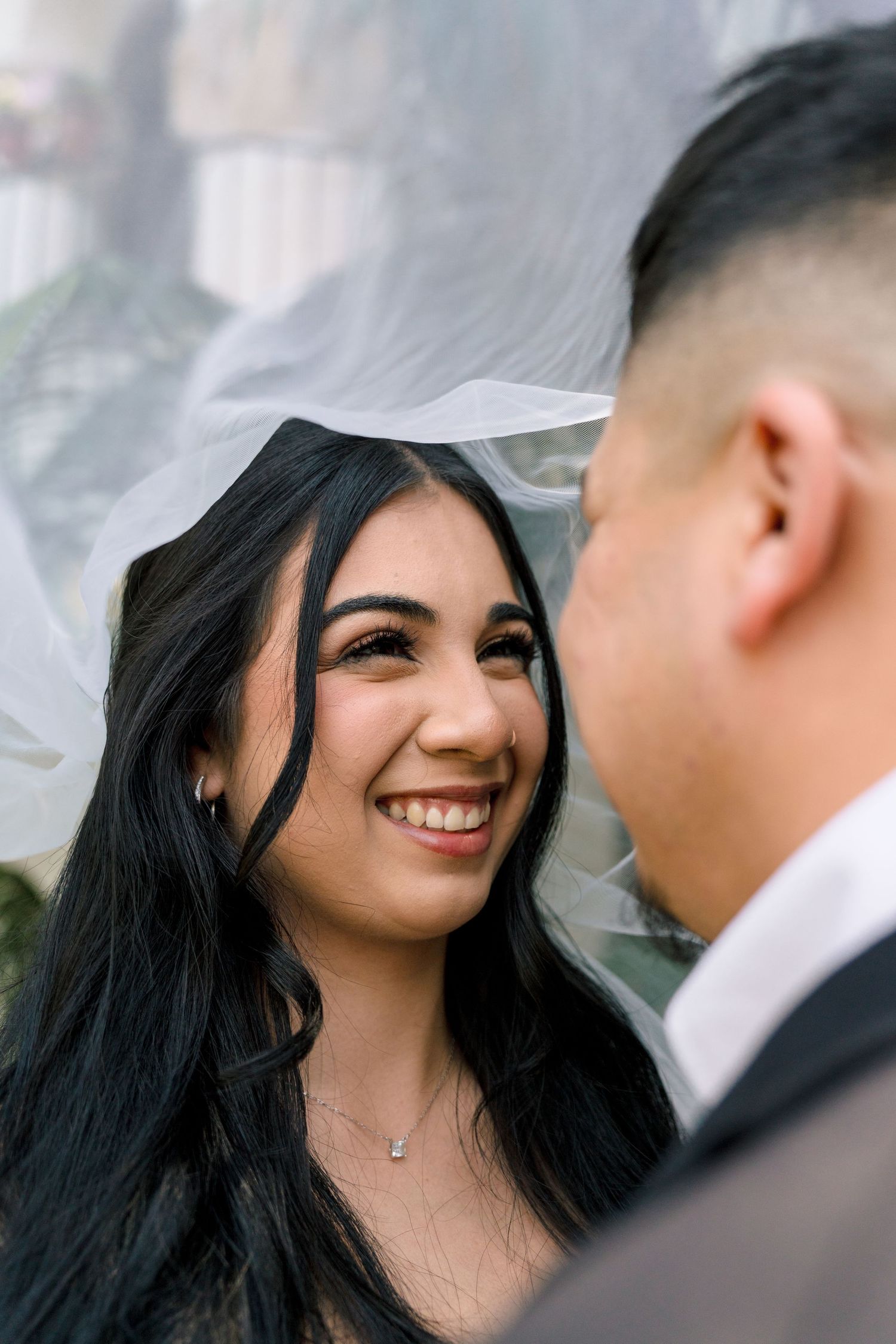Close-up wedding photos showing joyful moments between the couple.