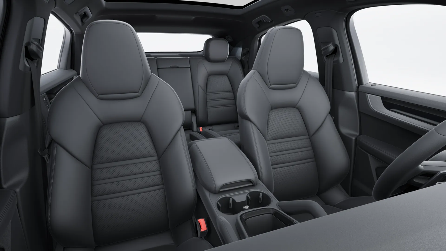 A Porsche Cayenne interior features black leather seats with contrast stitching and sporty bolsters in a luxury vehicle cabin.