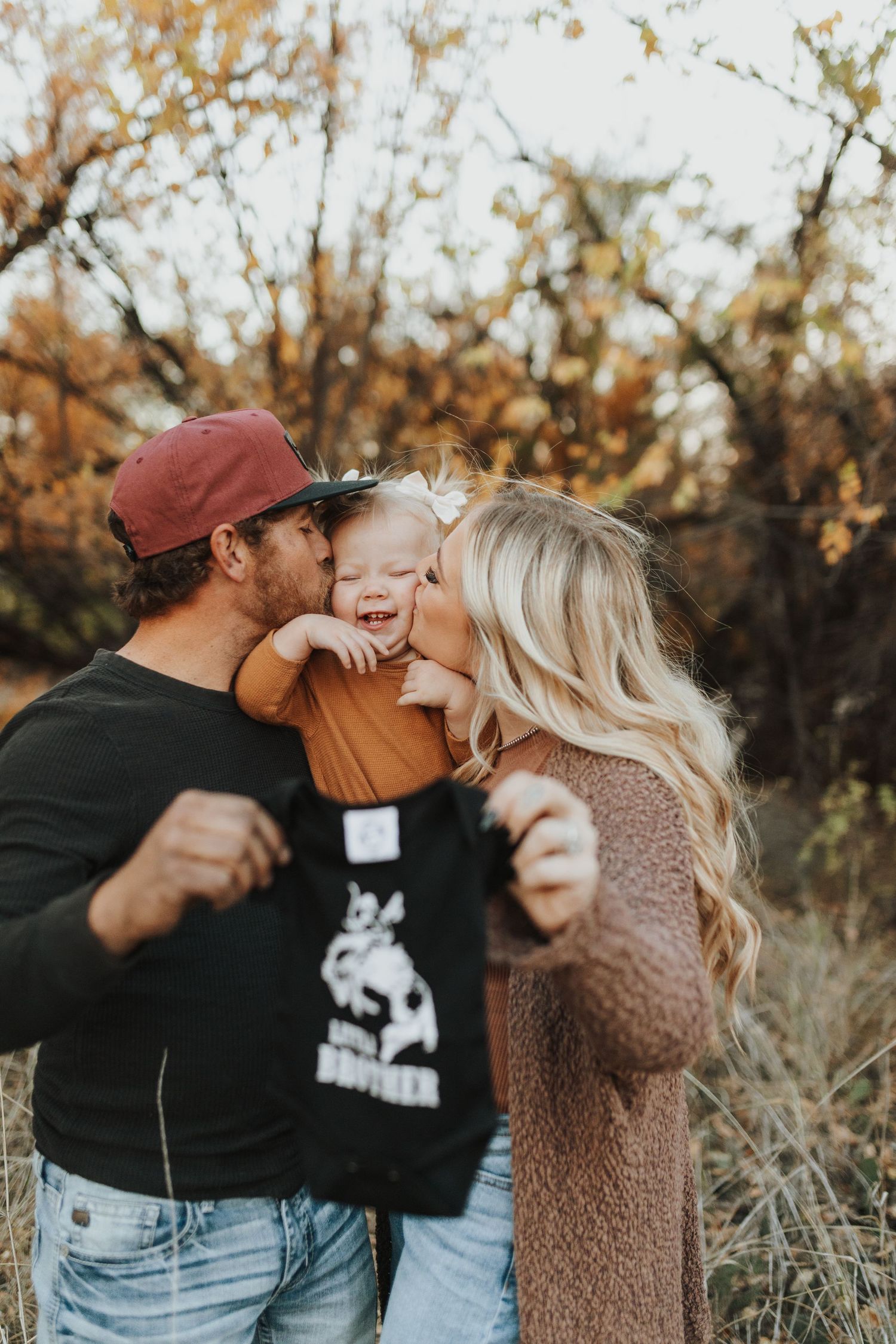 Family sharing joyful moment together outdoors during autumn season.