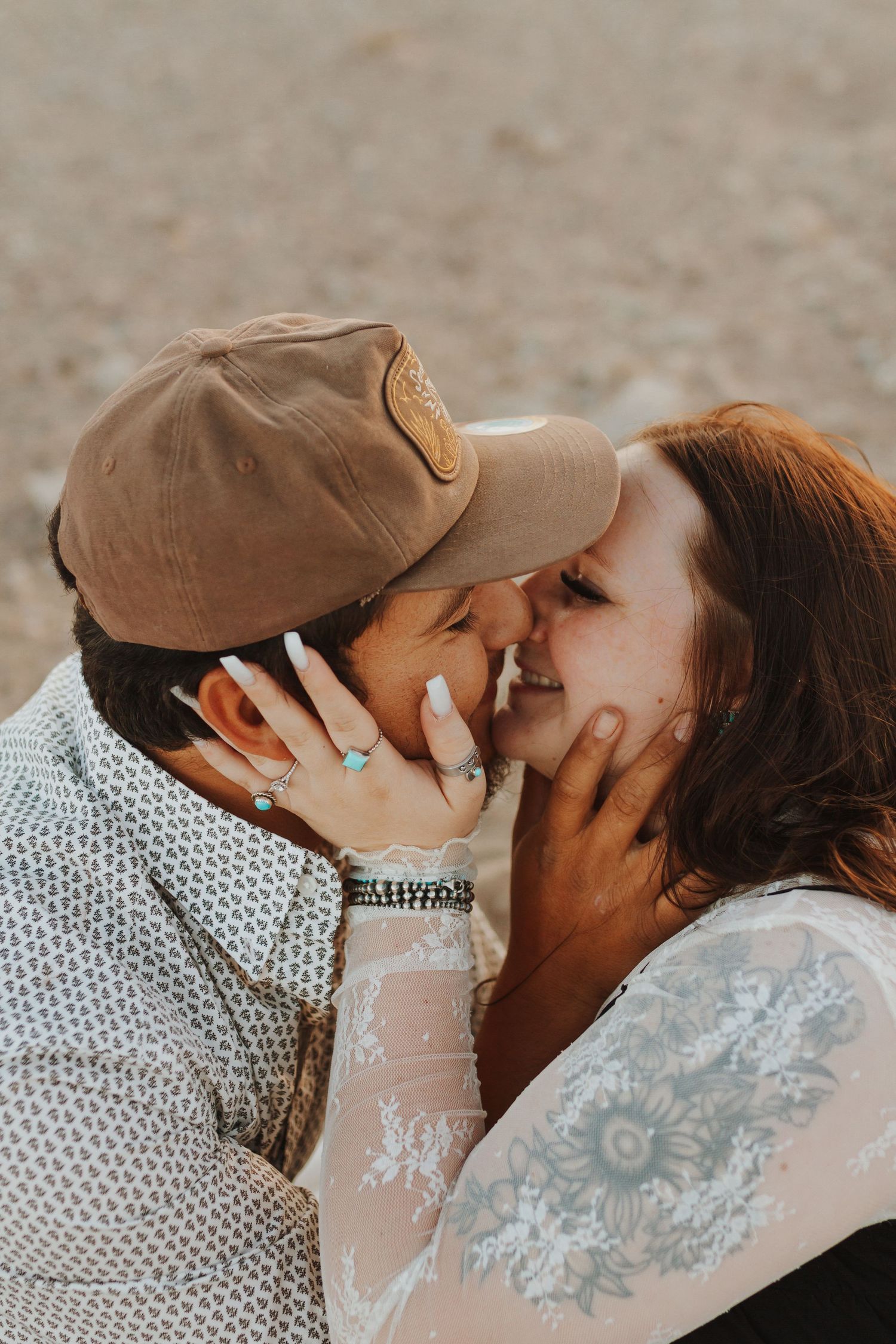 Intimate close-up moment between couple during outdoor photoshoot.