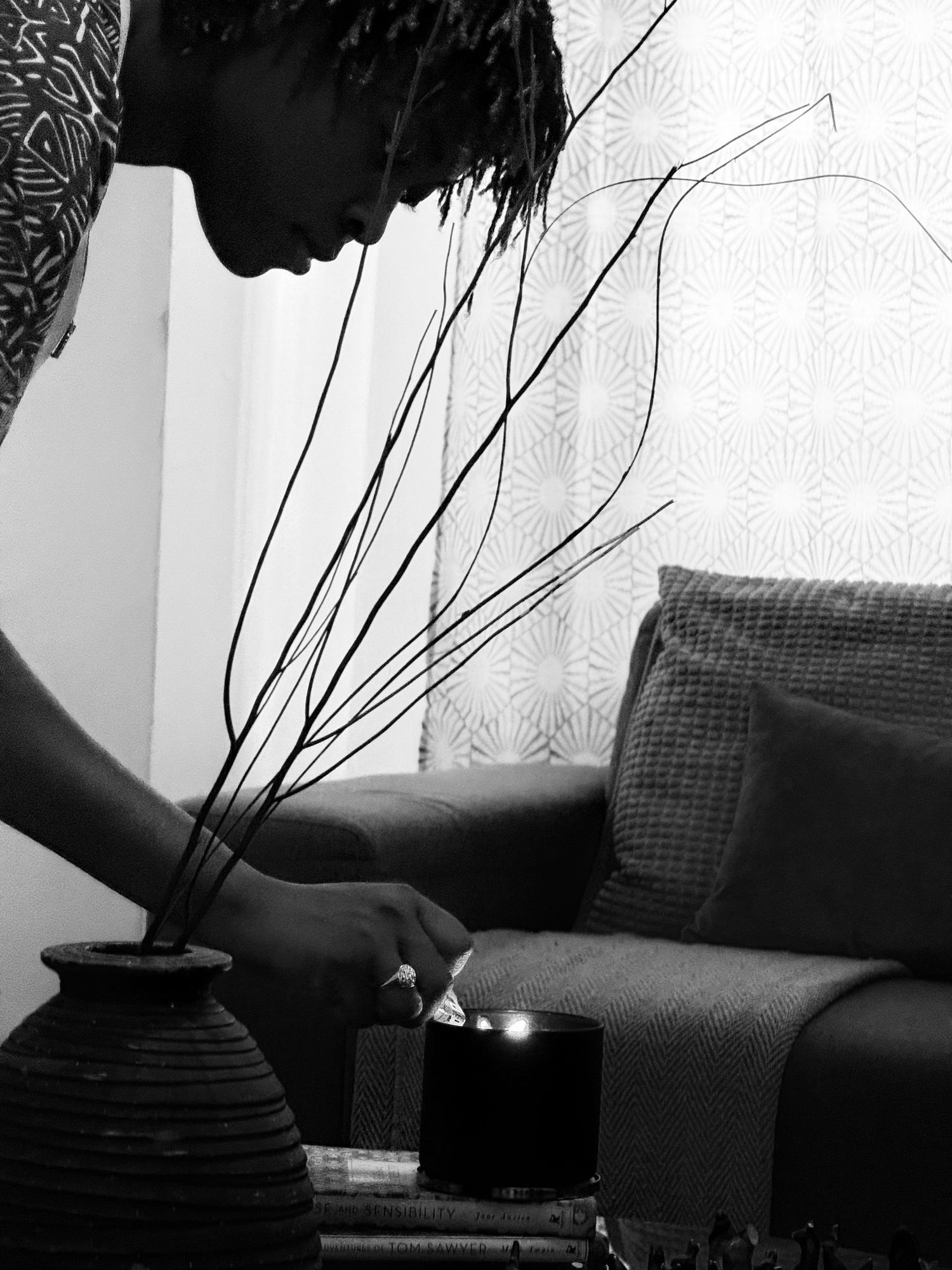 Moody black and white interior shots with dramatic shadows and furniture silhouettes.