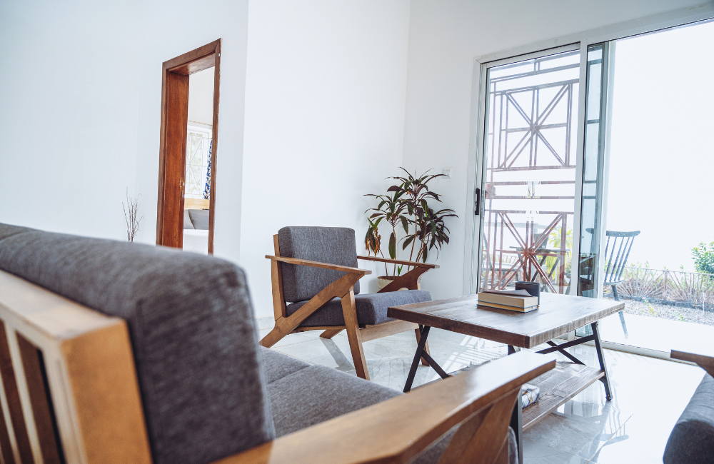 Minimalist modern office space with white walls and large windows.
