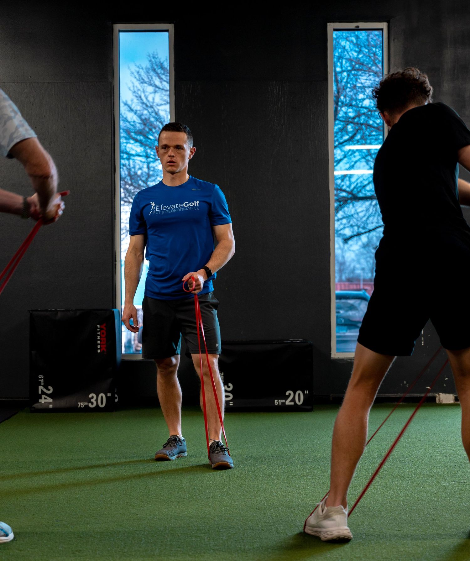 a group of people fitness training with resistance bands