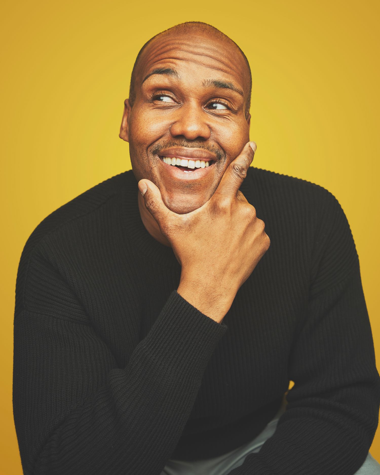VA Media Group yellow background studio headshot