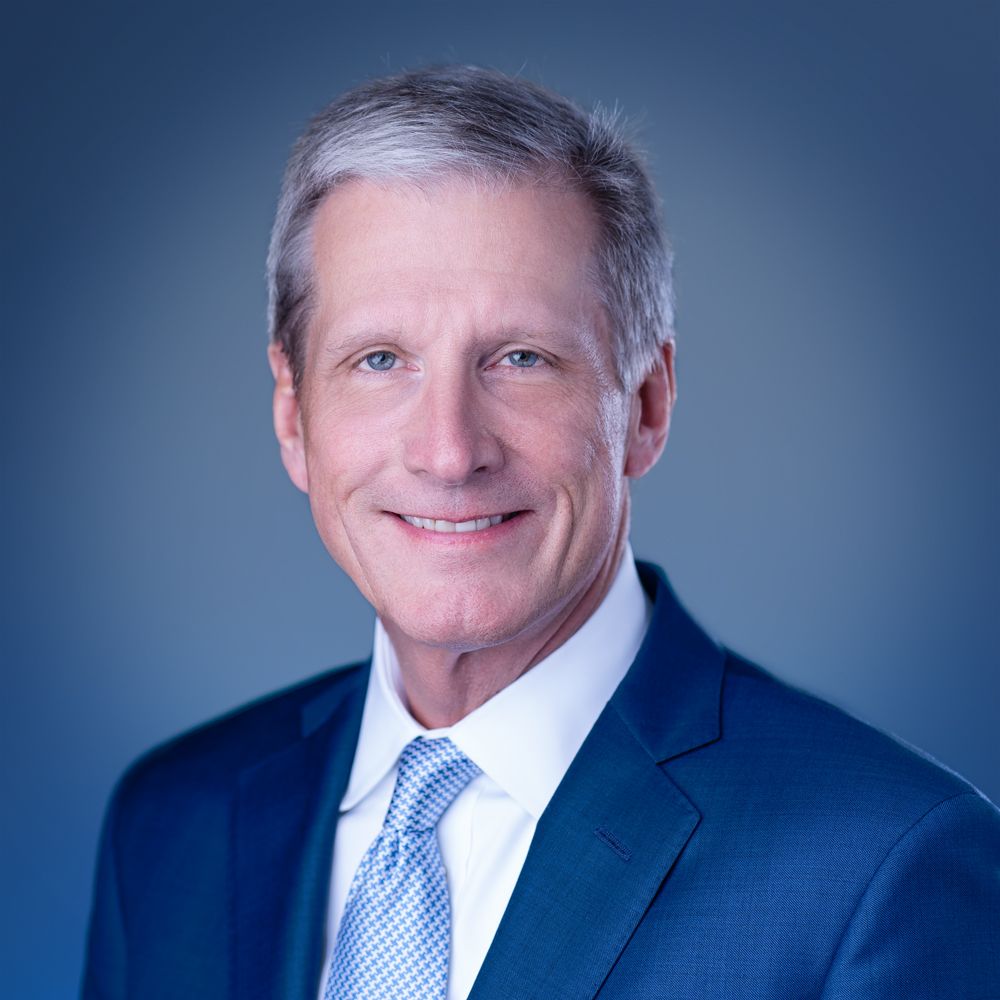 VA Media Group blue background headshot