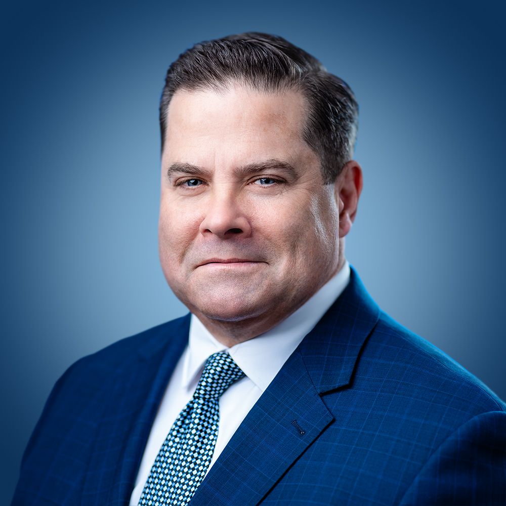 VA Media Group blue background headshot