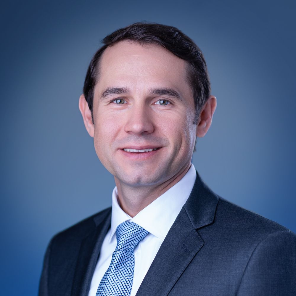 VA Media Group blue background headshot