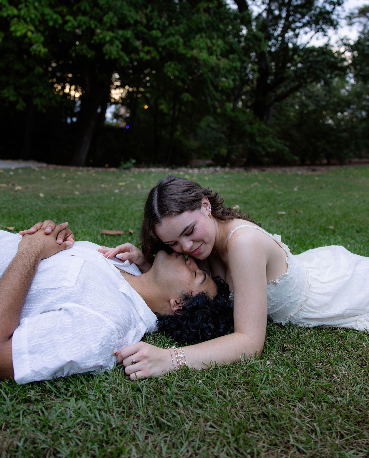Artistic portrait series of someone lying in green grass.
