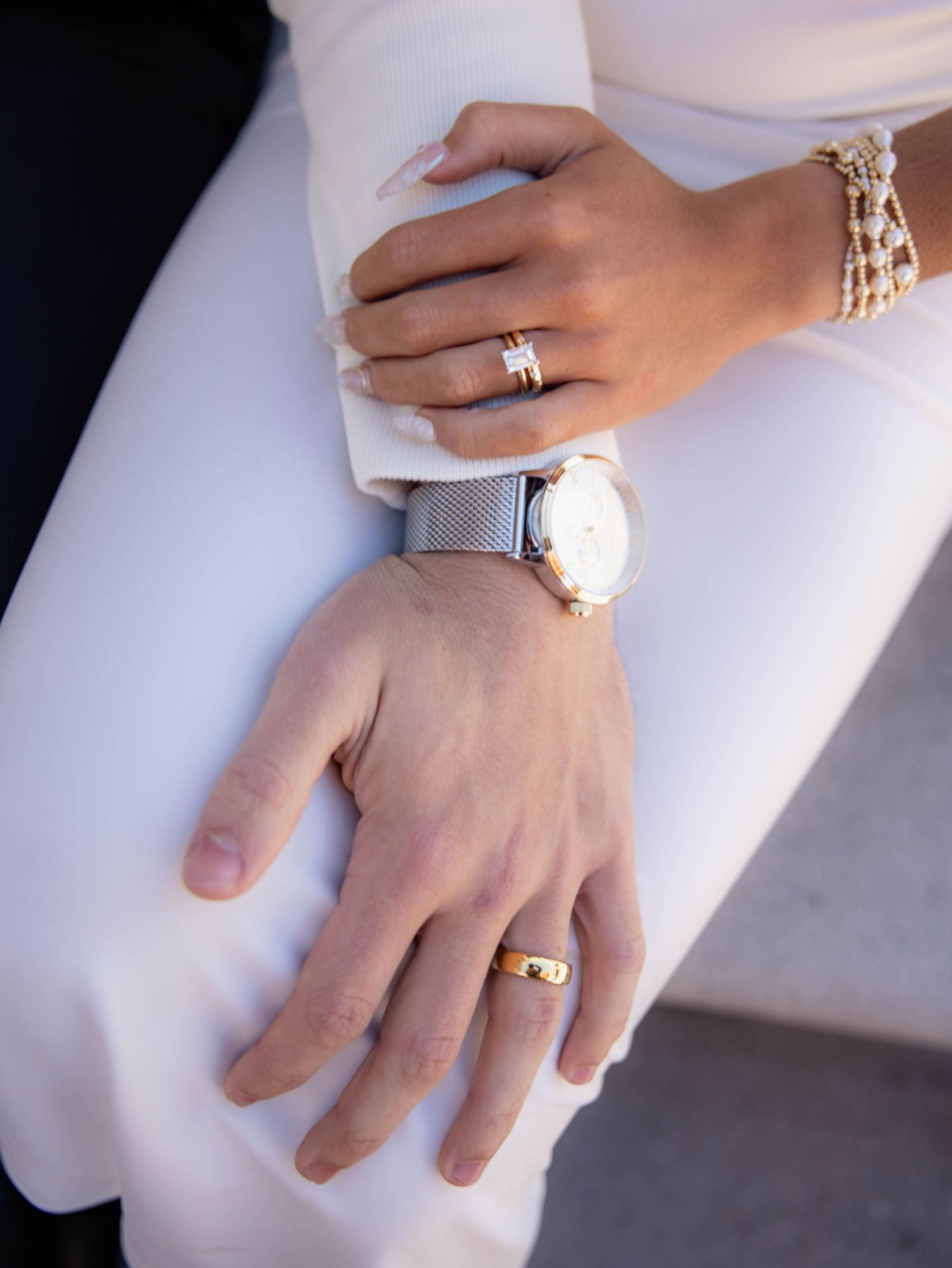 Newly married couples showcasing their wedding rings
