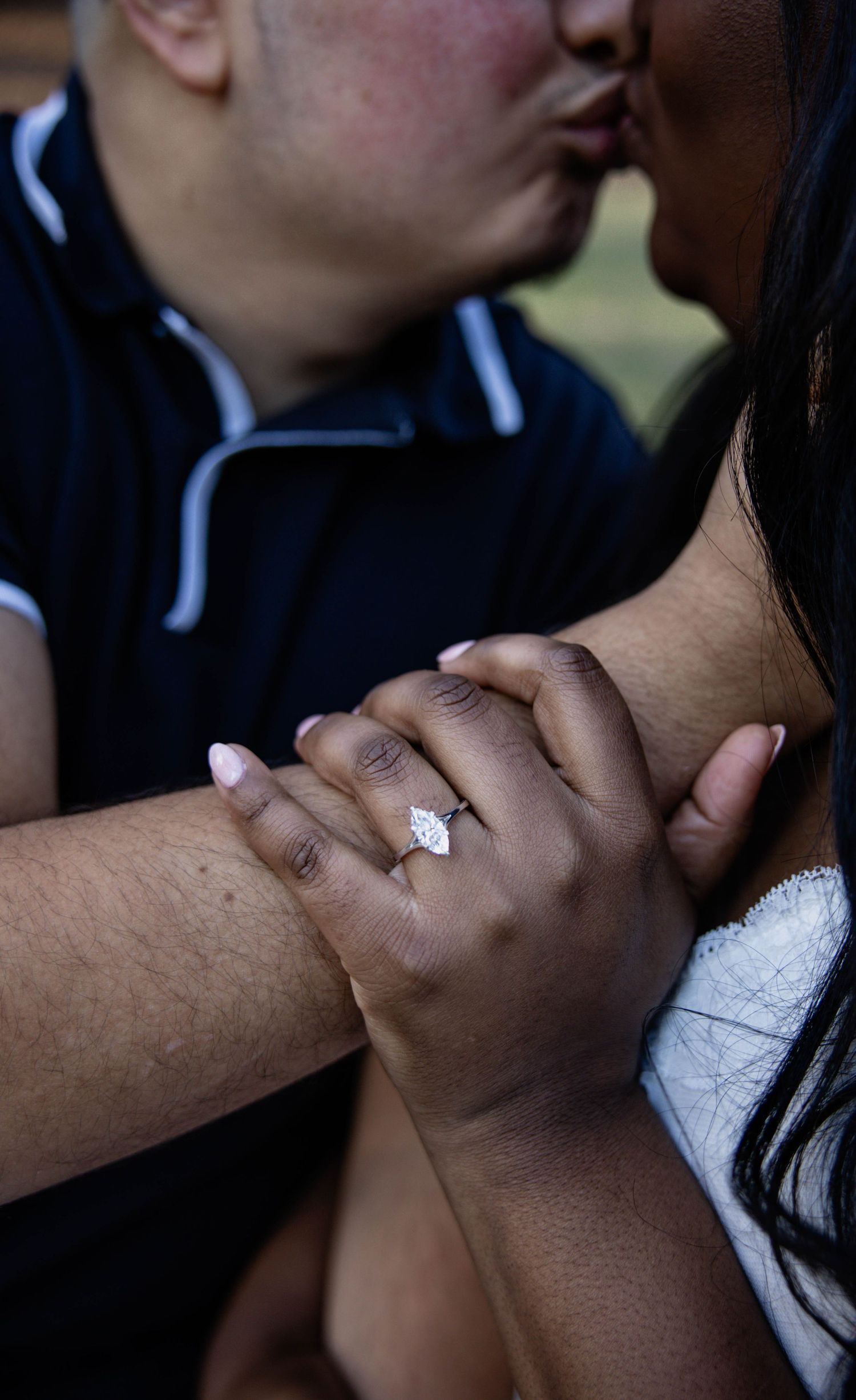 A close-up photo series showing a couple's hands and a diamond engagement ring in different romantic poses.