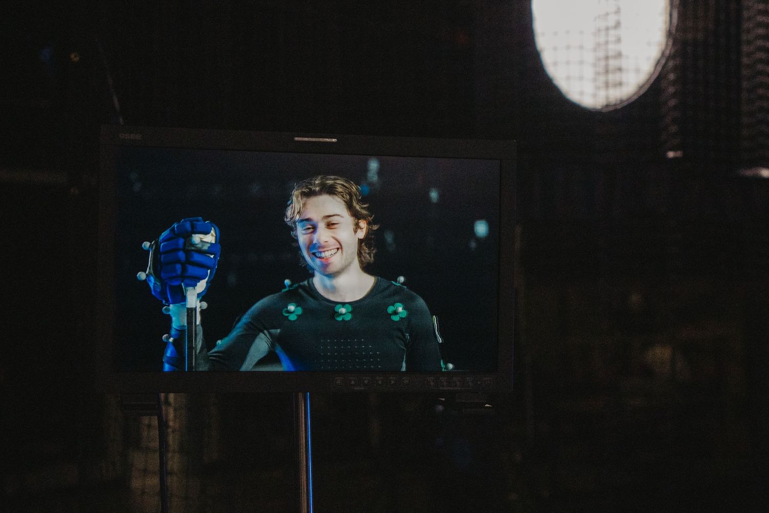 Monitor display shows motion capture performance being filmed in studio.