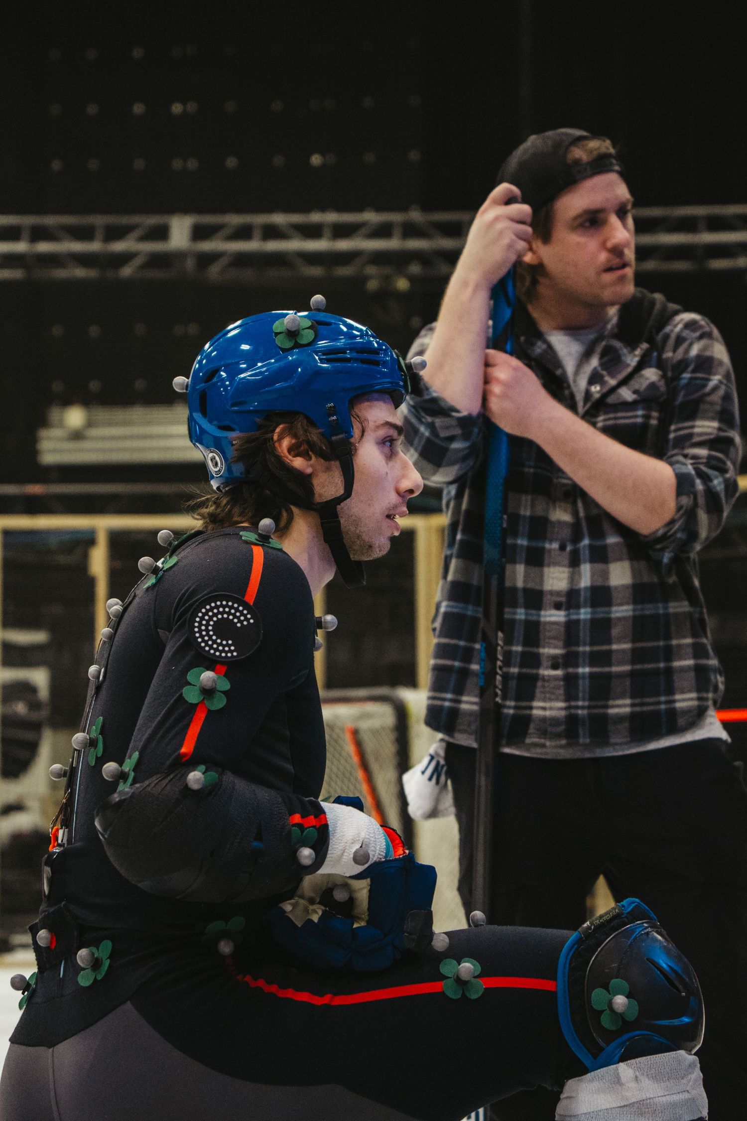 Motion capture performers in hockey gear during a production shoot.