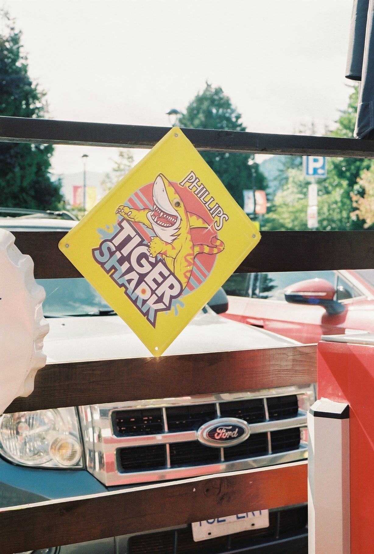 Yellow Finger Skateboard promotional sign displayed against truck windshield.