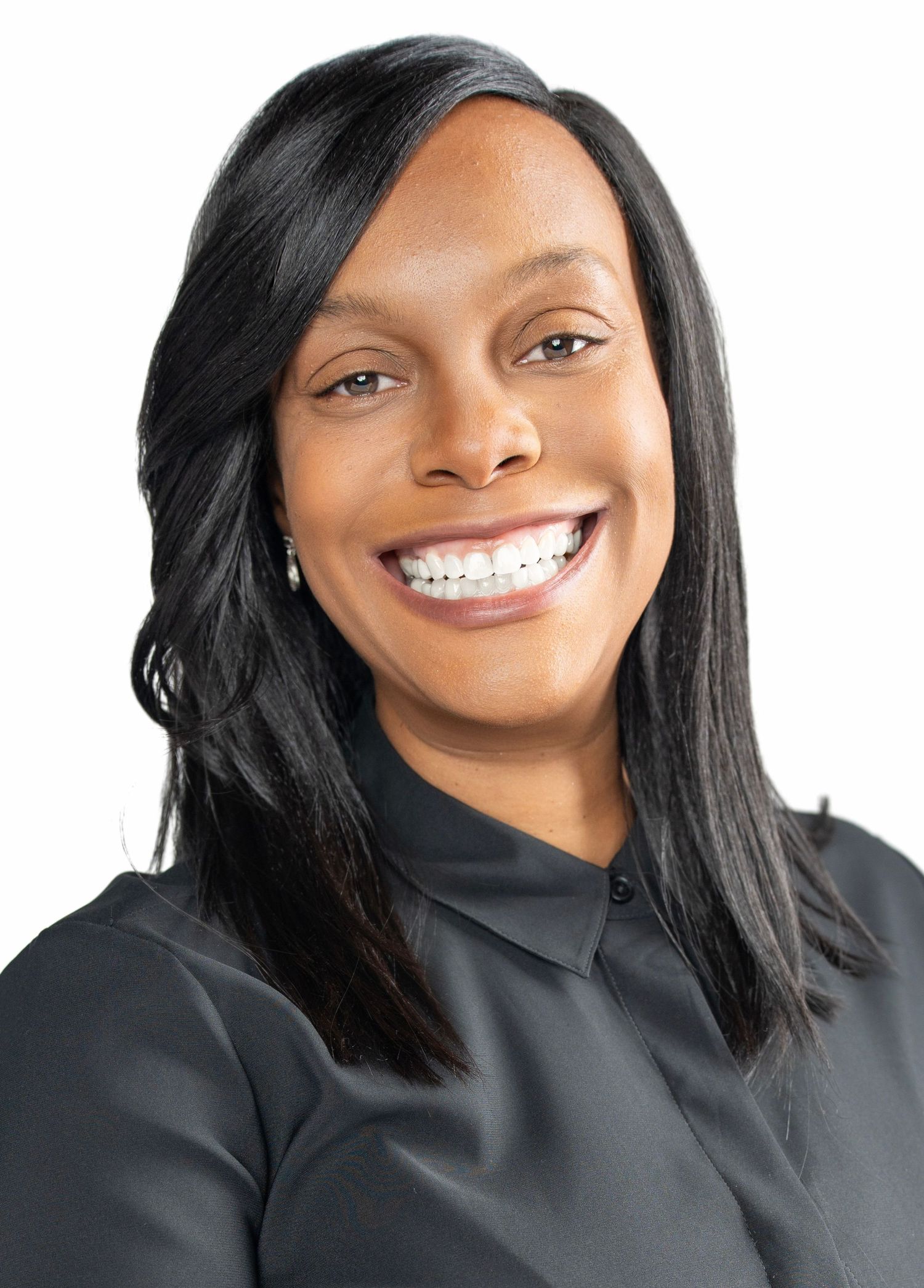 Professional portrait series showing warm smiles and expressions against a light background wearing a black top.