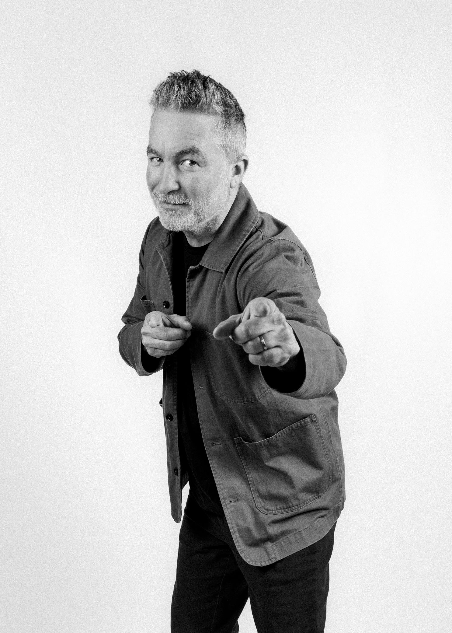 Dai Henwood NZ comedian Pointing to the camera for a fun candid photoshoot. Professional branding portarits. CL Photography