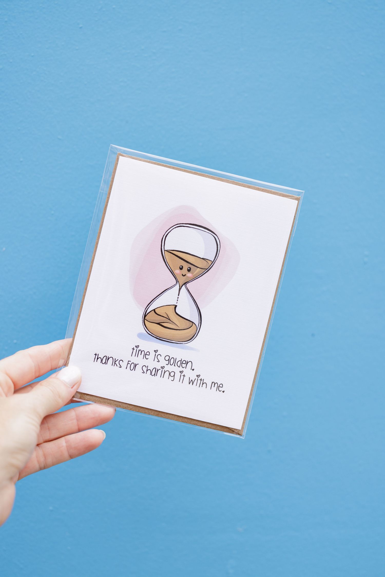 Small illustrated cards with hourglass designs on a blue background.