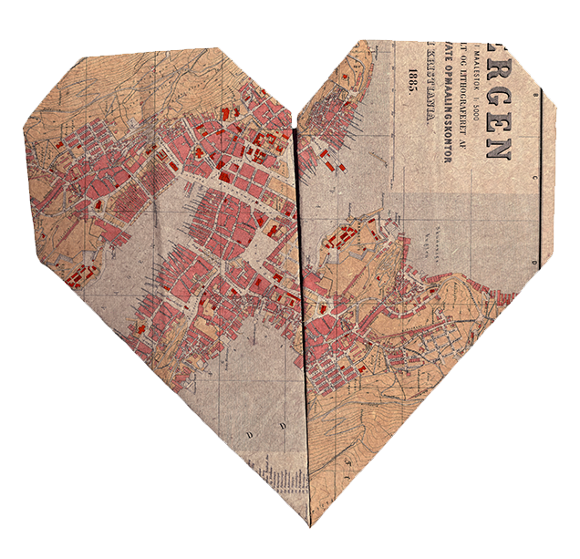 Heart-shaped collage made from vintage map pieces showing city streets and buildings in red.