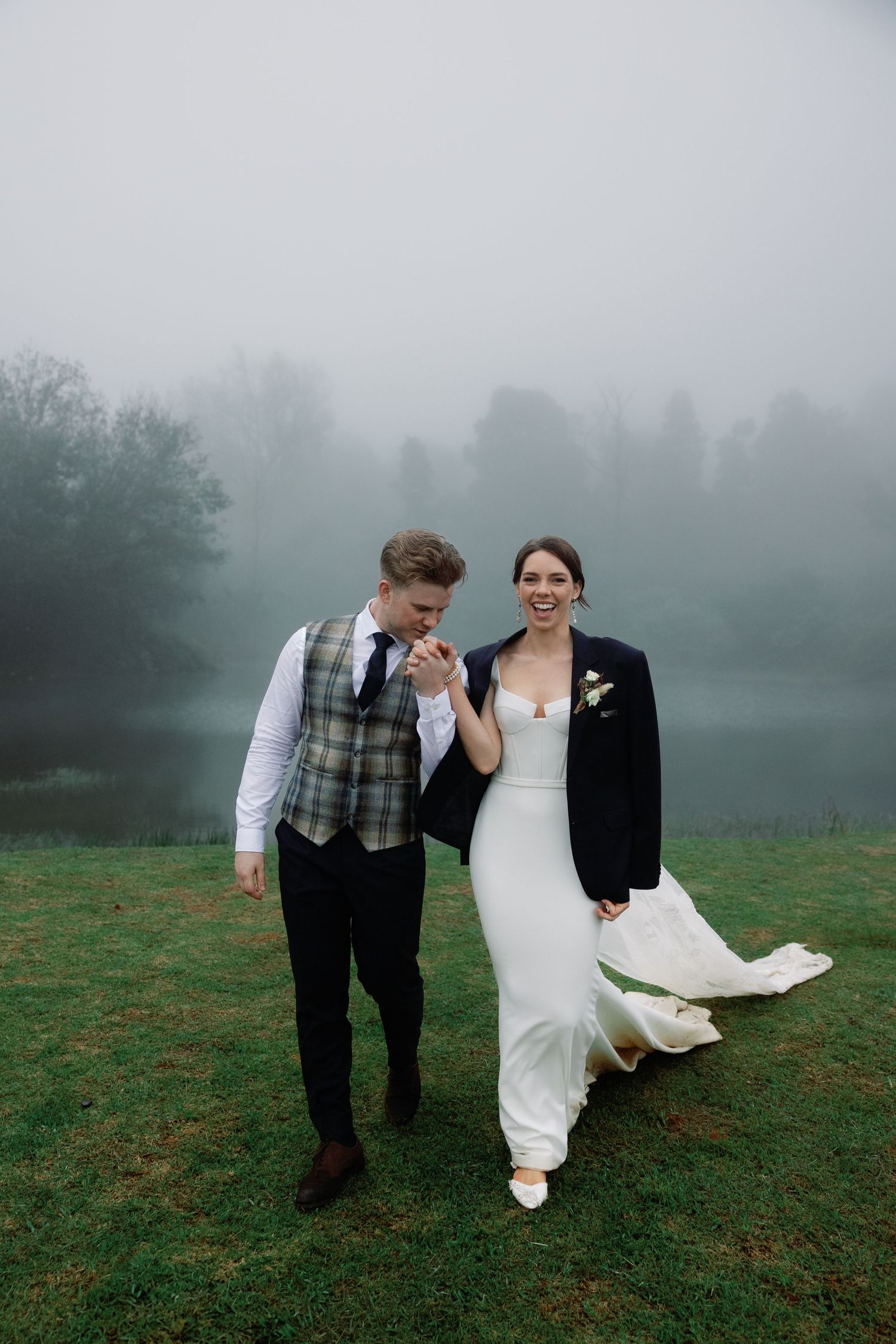 Three atmospheric wedding photos show figures walking through a misty green field on an overcast day.