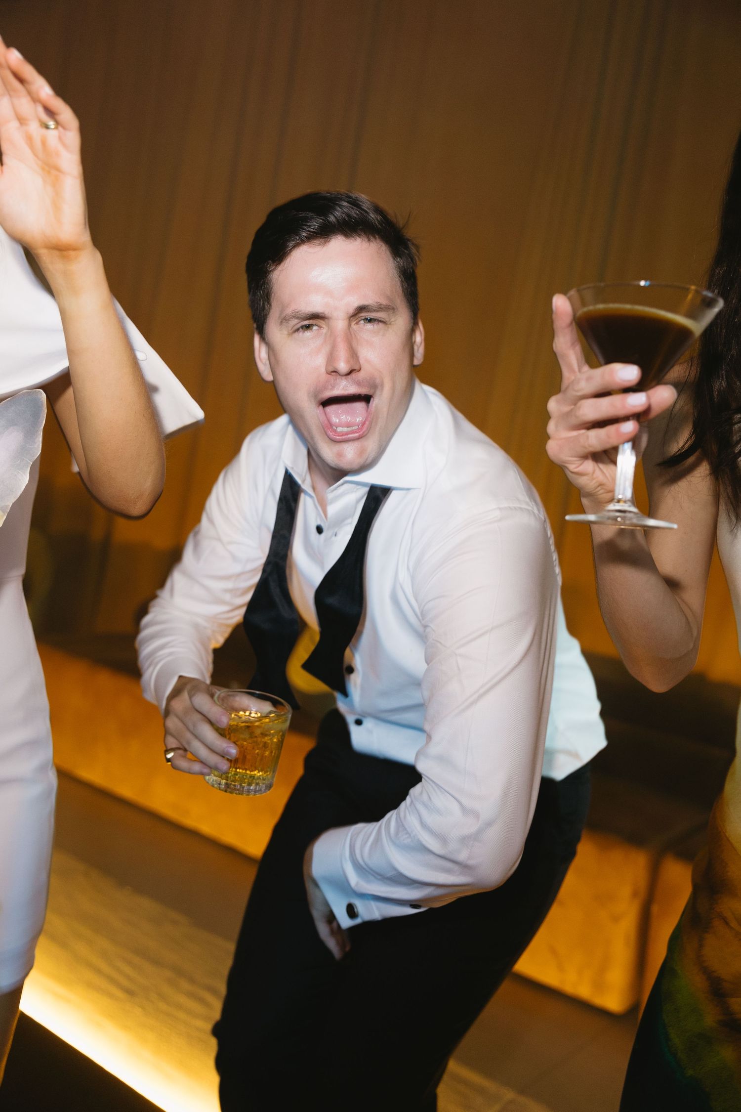 A sequence of candid dance floor moments showing someone in a white dress shirt enjoying themselves at a celebration.