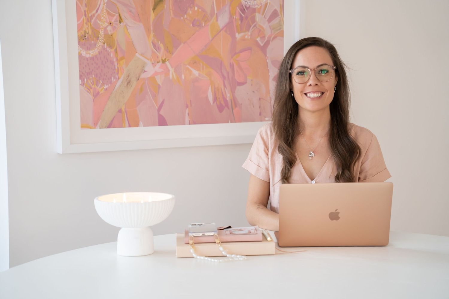 Cassie Louise Creative Photographer - woman sitting at desk using her laptop