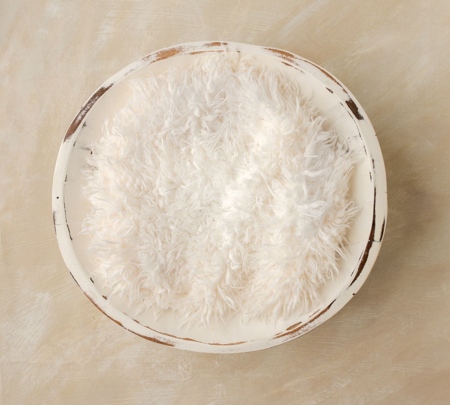 White fluffy fur-lined distressed round wooden bowl for newborn photography props.