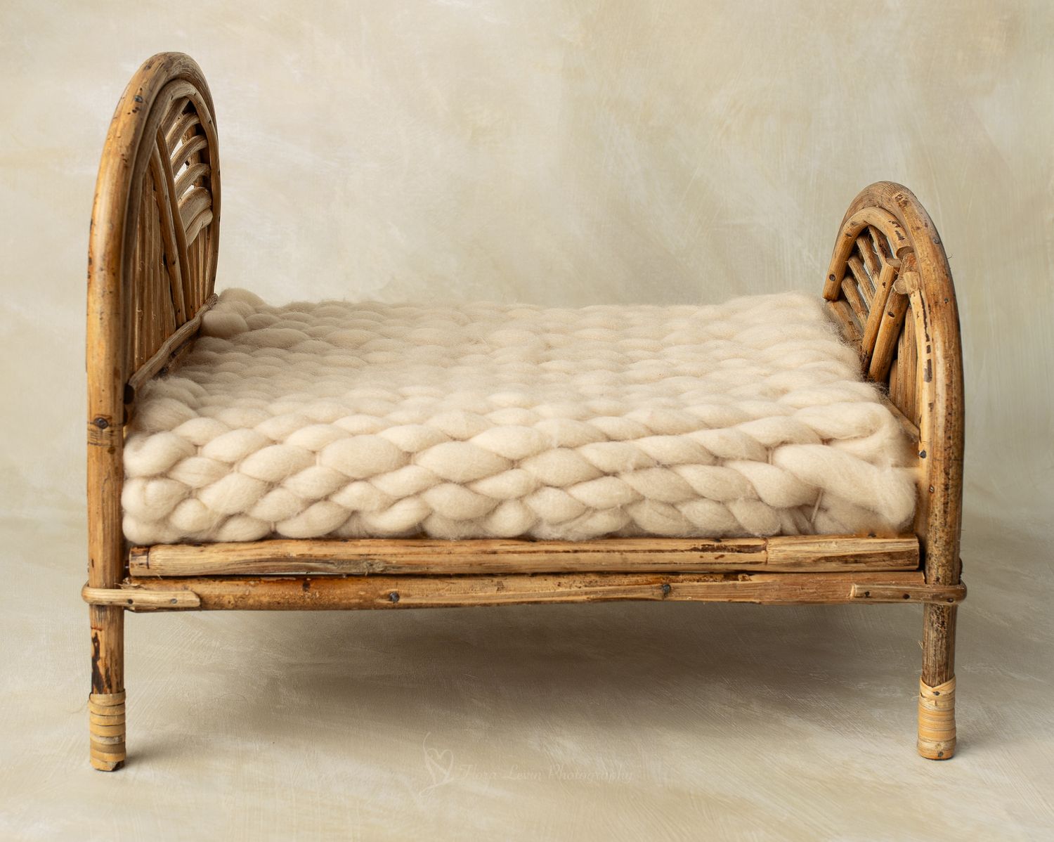 Rustic bedwith chunky knit wool blanket, perfect for newborn photography props.
