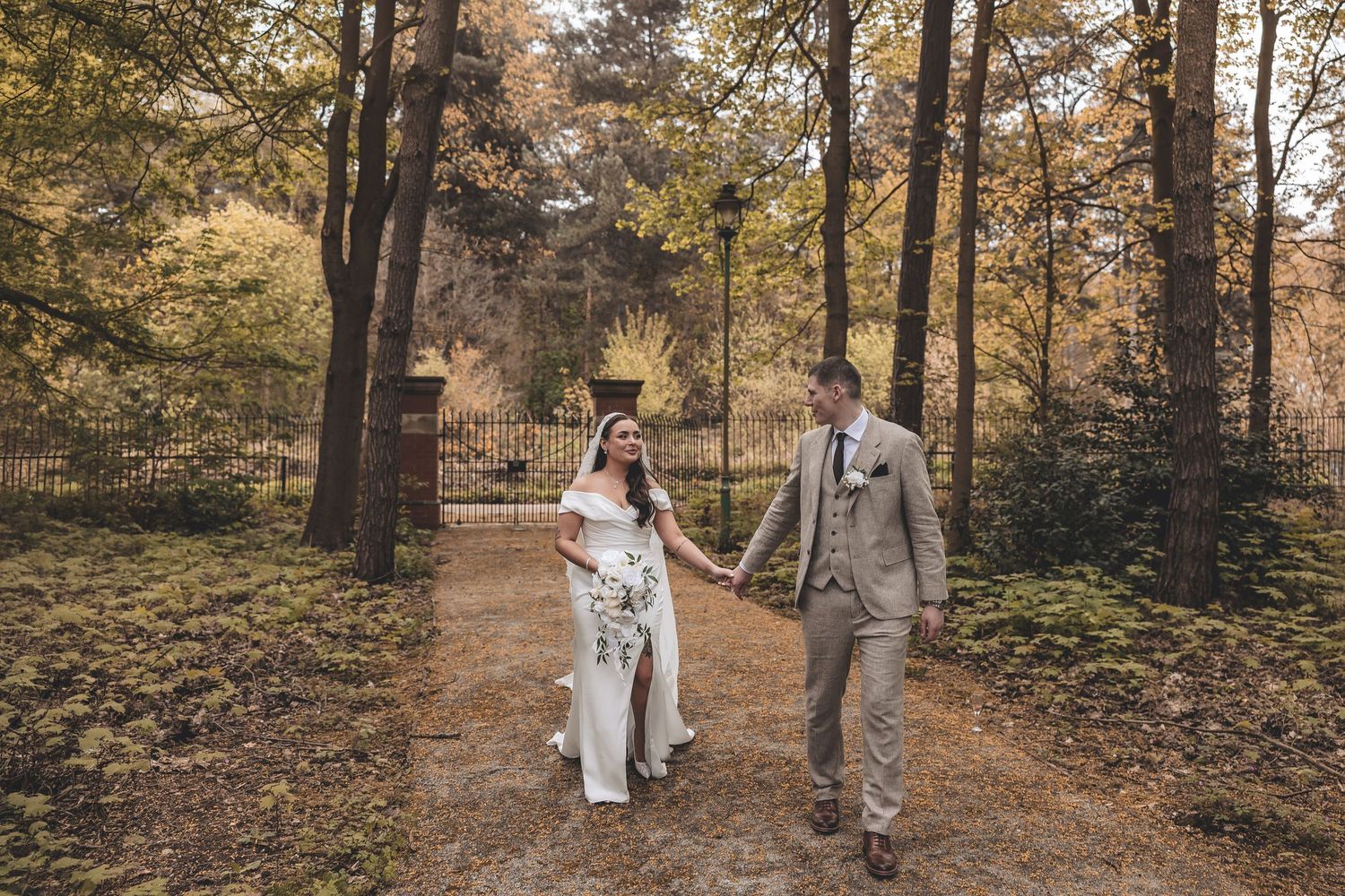 A rare candid quiet couple moment during a walk on their wedding day.