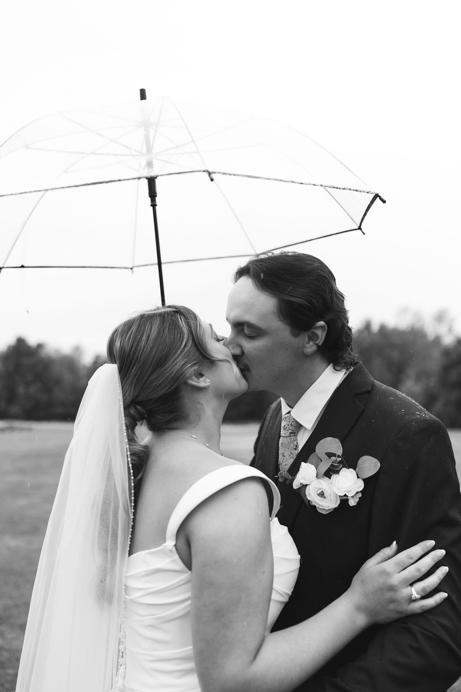 A romantic wedding sequence shows three progressive shots of a couple sharing their first kiss as newlyweds.