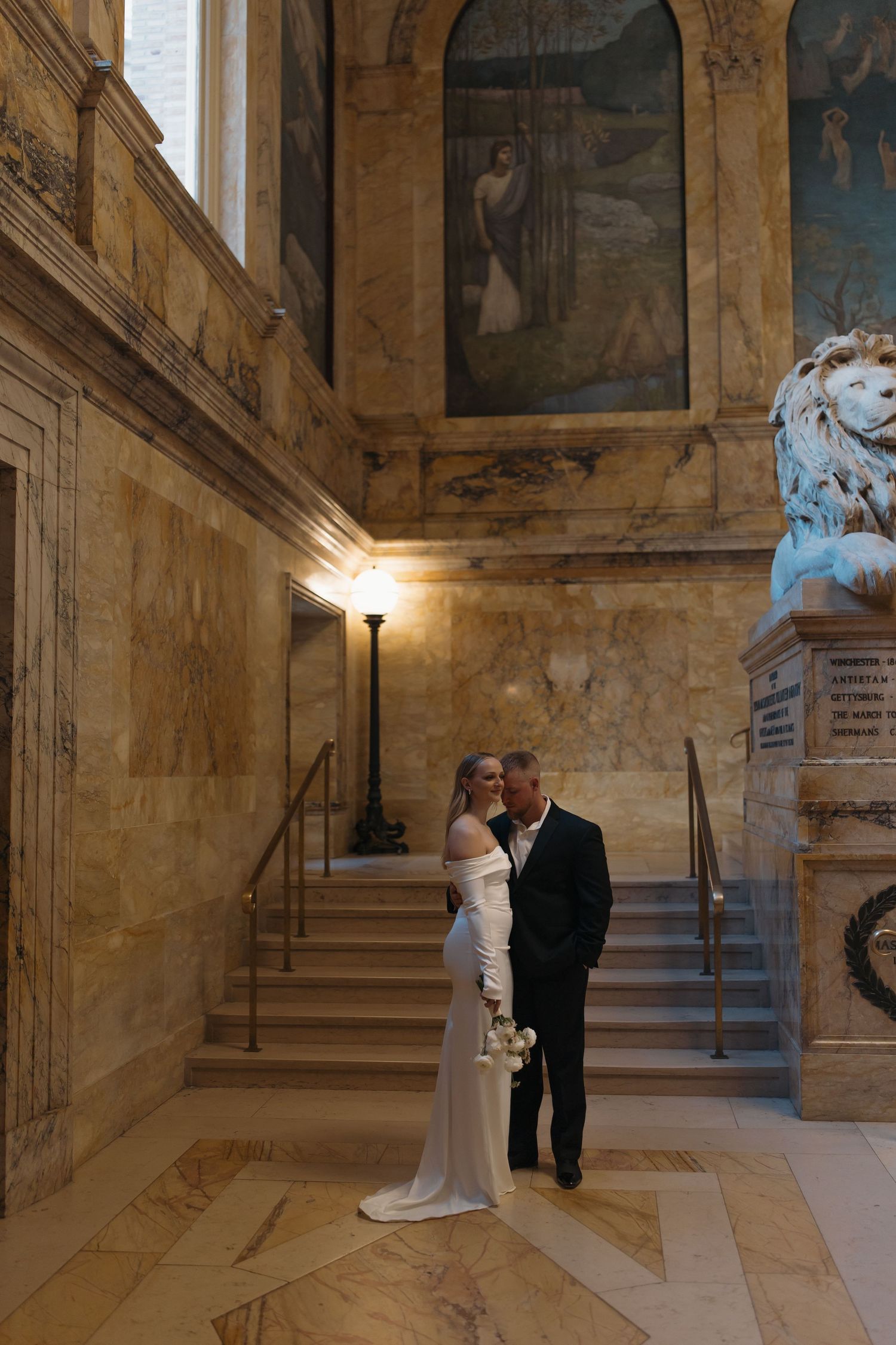 A romantic wedding photoshoot sequence showing tender moments between a couple in a grand historic building interior.