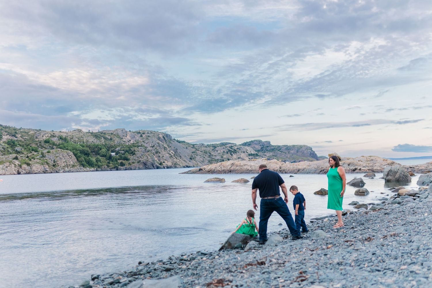 People searching for treasures along a beautiful coastal shoreline at sunset. Photography in Brigus, Newfoundland and Labrador