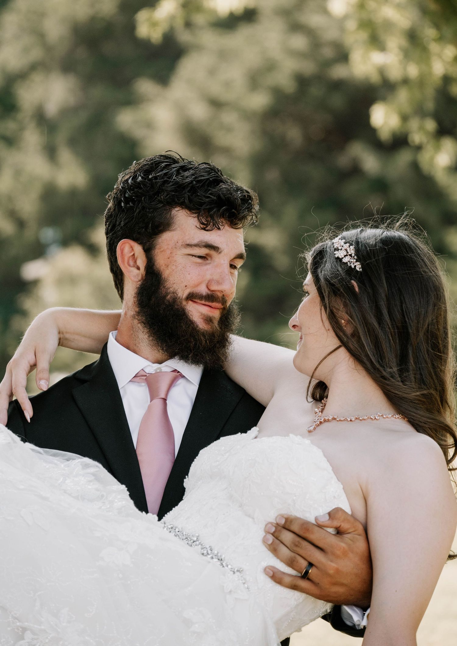 Groom holding the bride in his arms in elk city, oklahoma