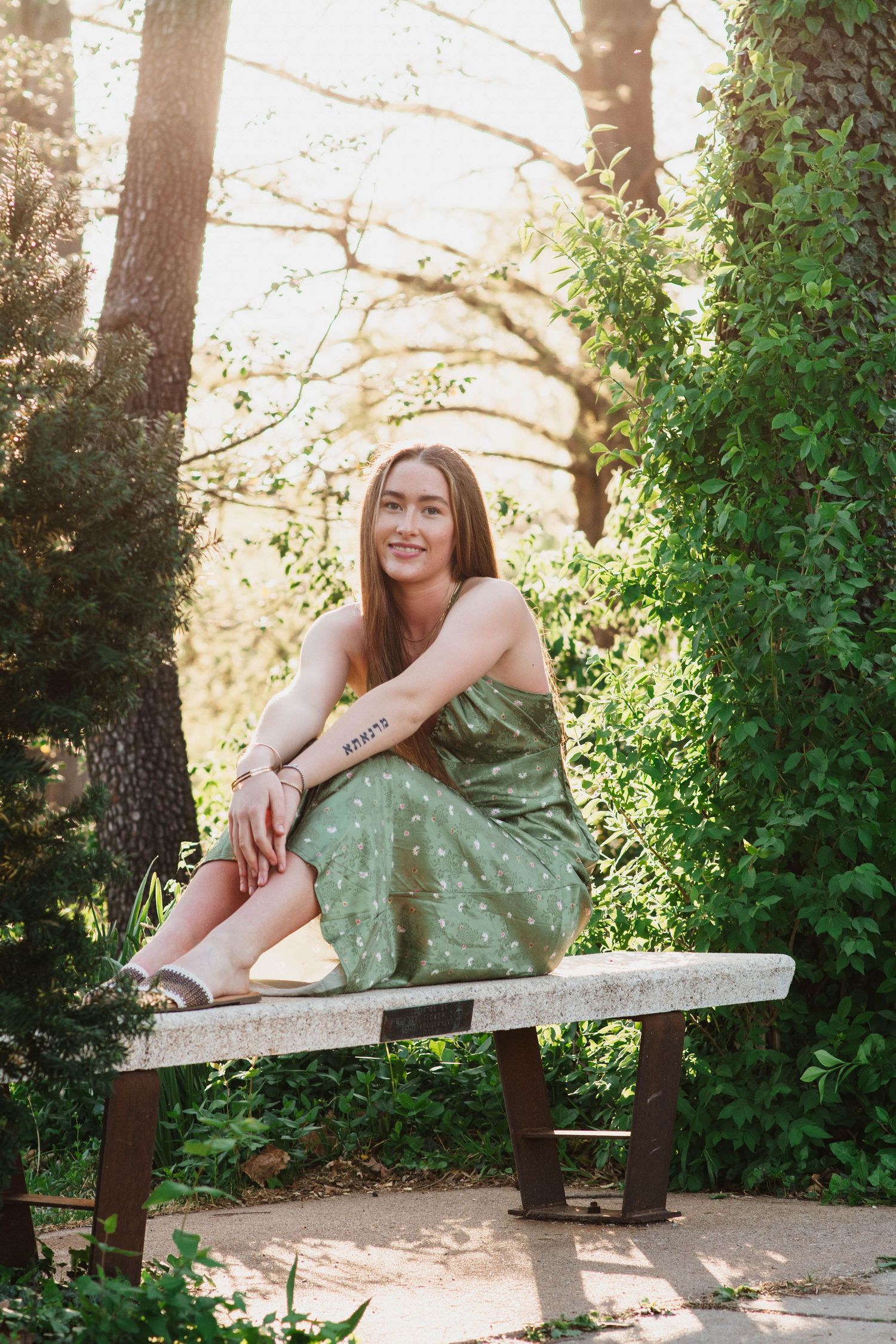 senior posing in the midst of lush gardens at Will Rogers Gardens in Oklahoma City, Oklahoma.