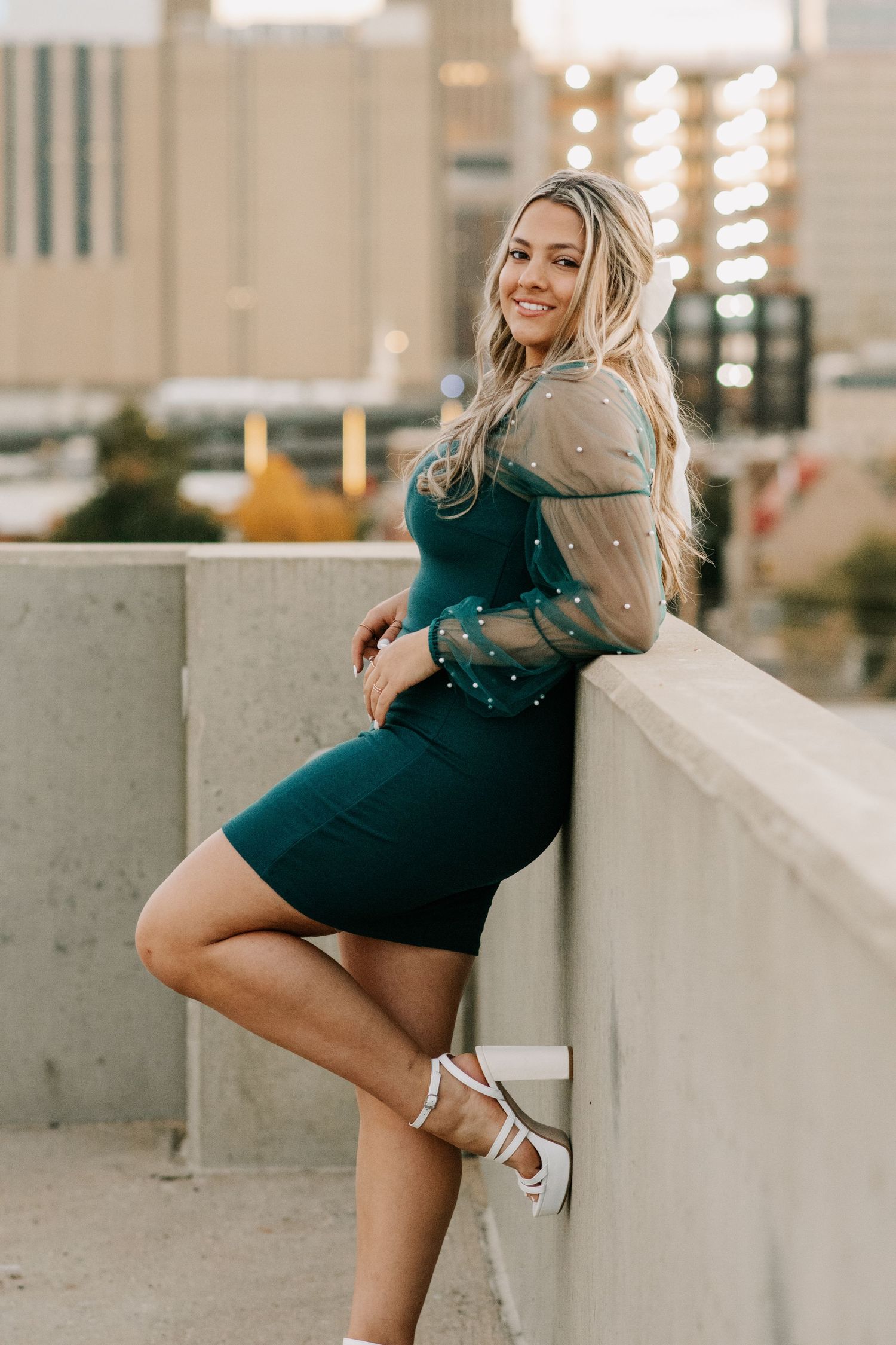 senior posing at her rooftop parking garage, senior session in Oklahoma City, Oklahoma.