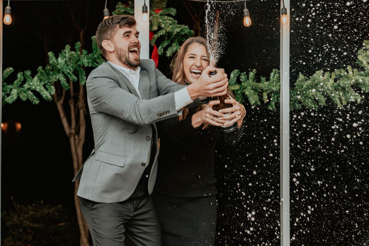 A joyful moment captured with water splashing during an outdoor celebration.
