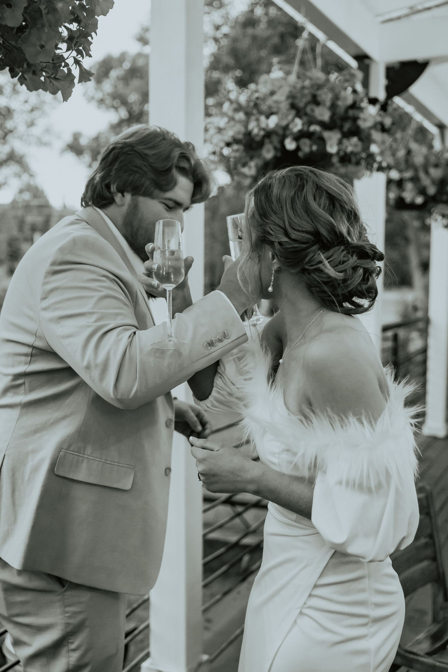 Black and white sequence of a couple sharing a romantic moment on a covered porch.