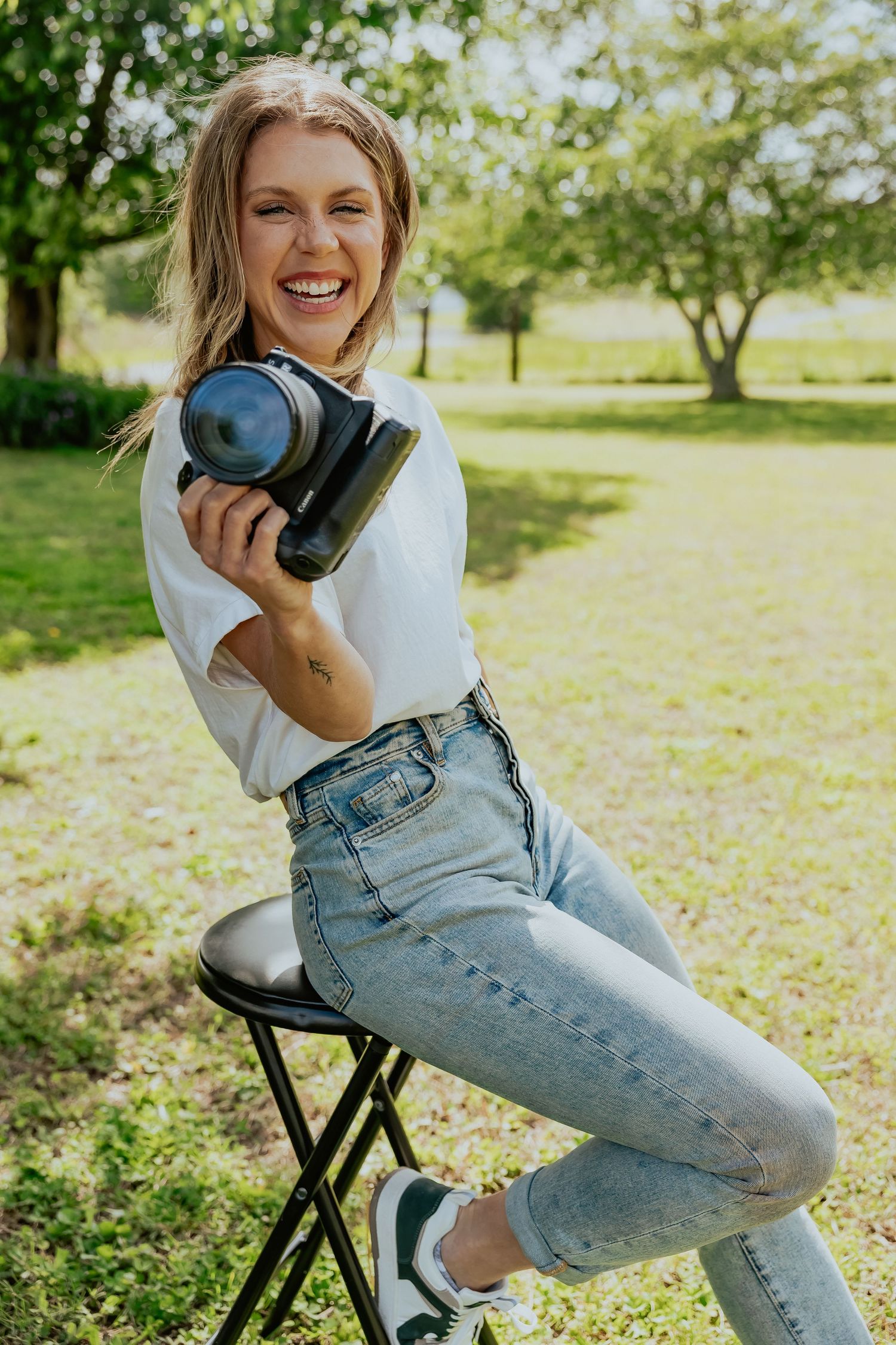 A series of casual lifestyle photos showing someone in a white sweater and jeans sitting on a black chair outdoors.