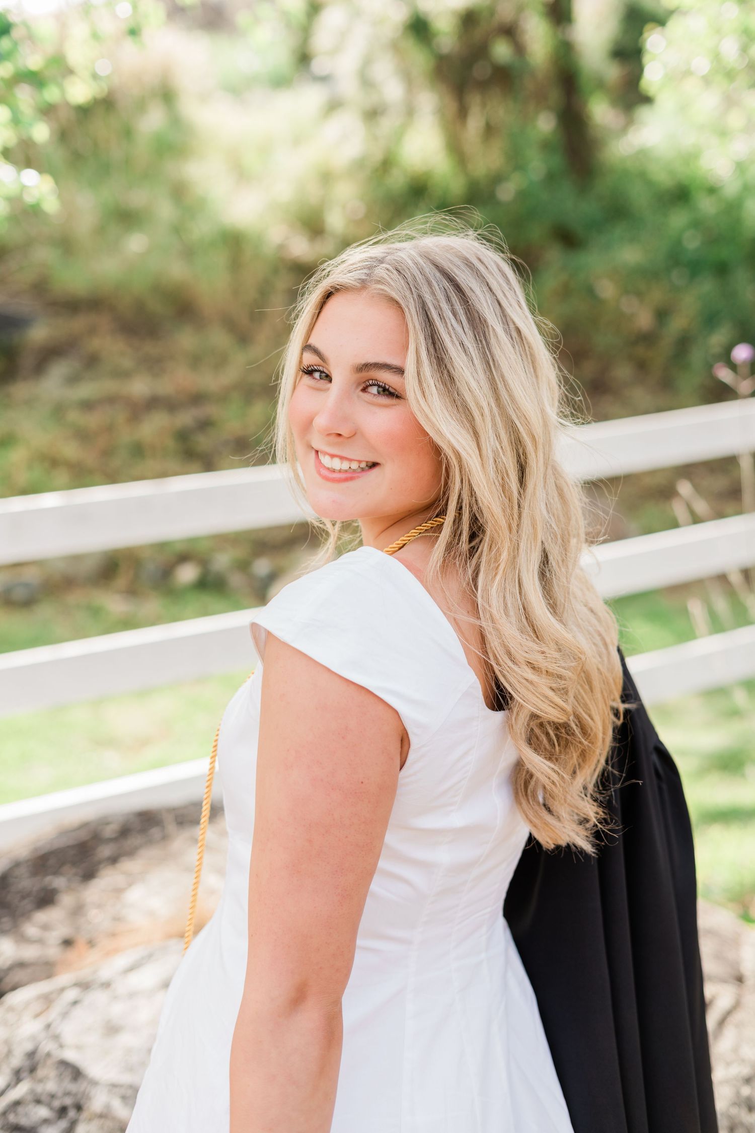San Luis Obispo senior photographer | senior session | madonna inn | senior in white dress for senior photos cap and gown | felisha connolly