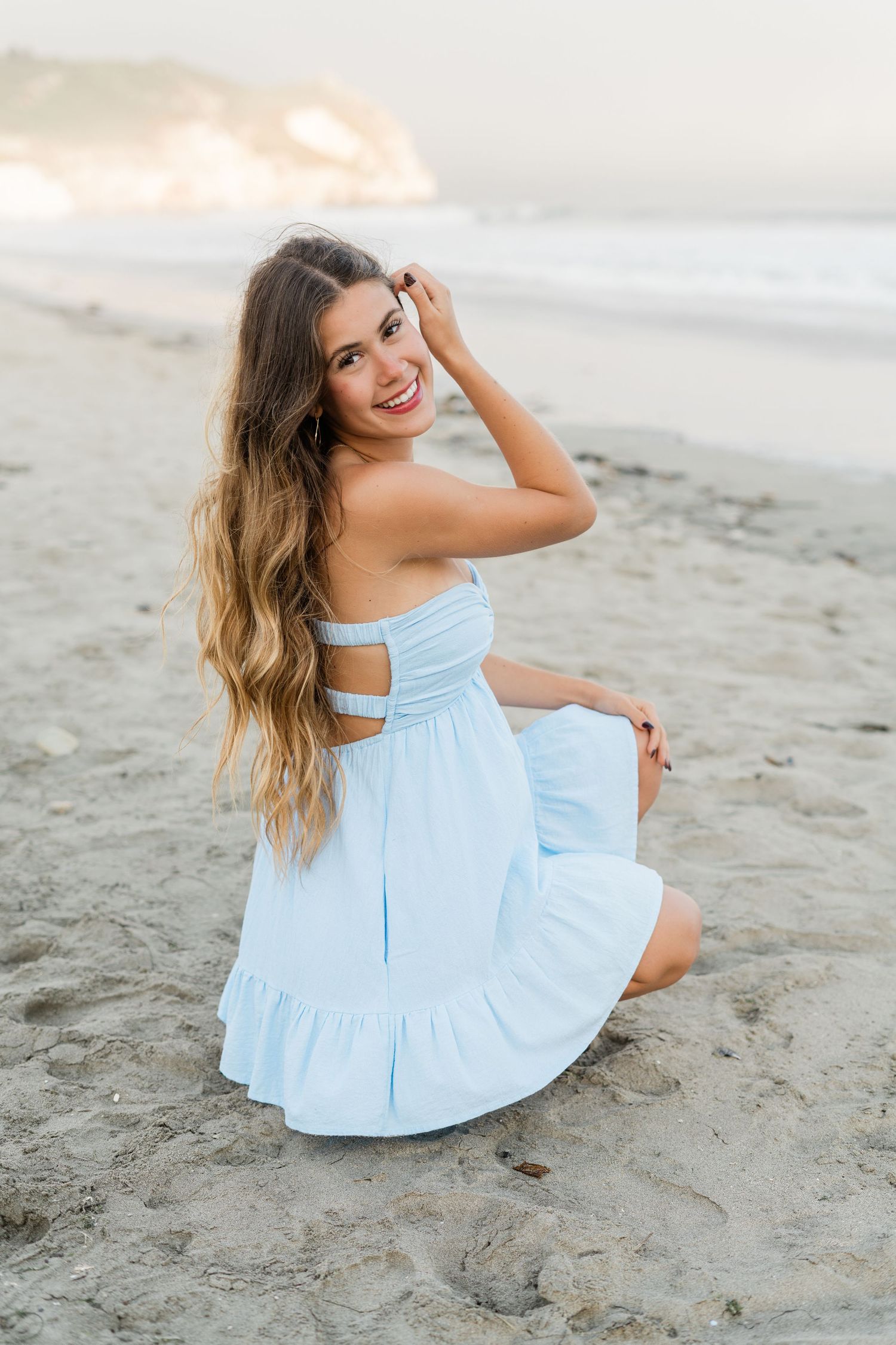 slo high senior in blue dress for senior session at Avila Beach on partly cloudy day, slo county senior photographer felisha connolly