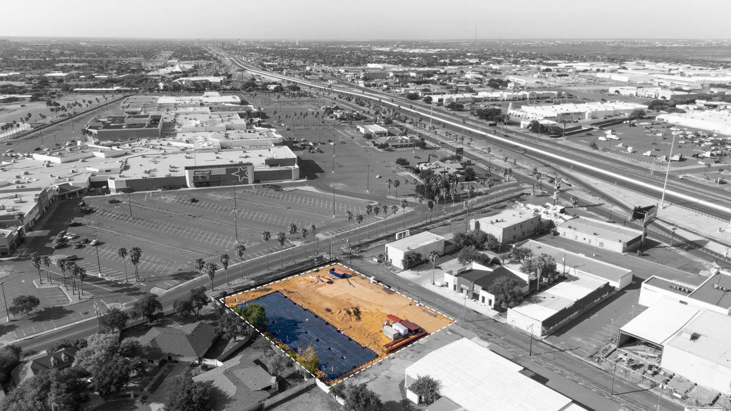 Aerial view sequence showing the historical development and expansion of an industrial facility over multiple decades.