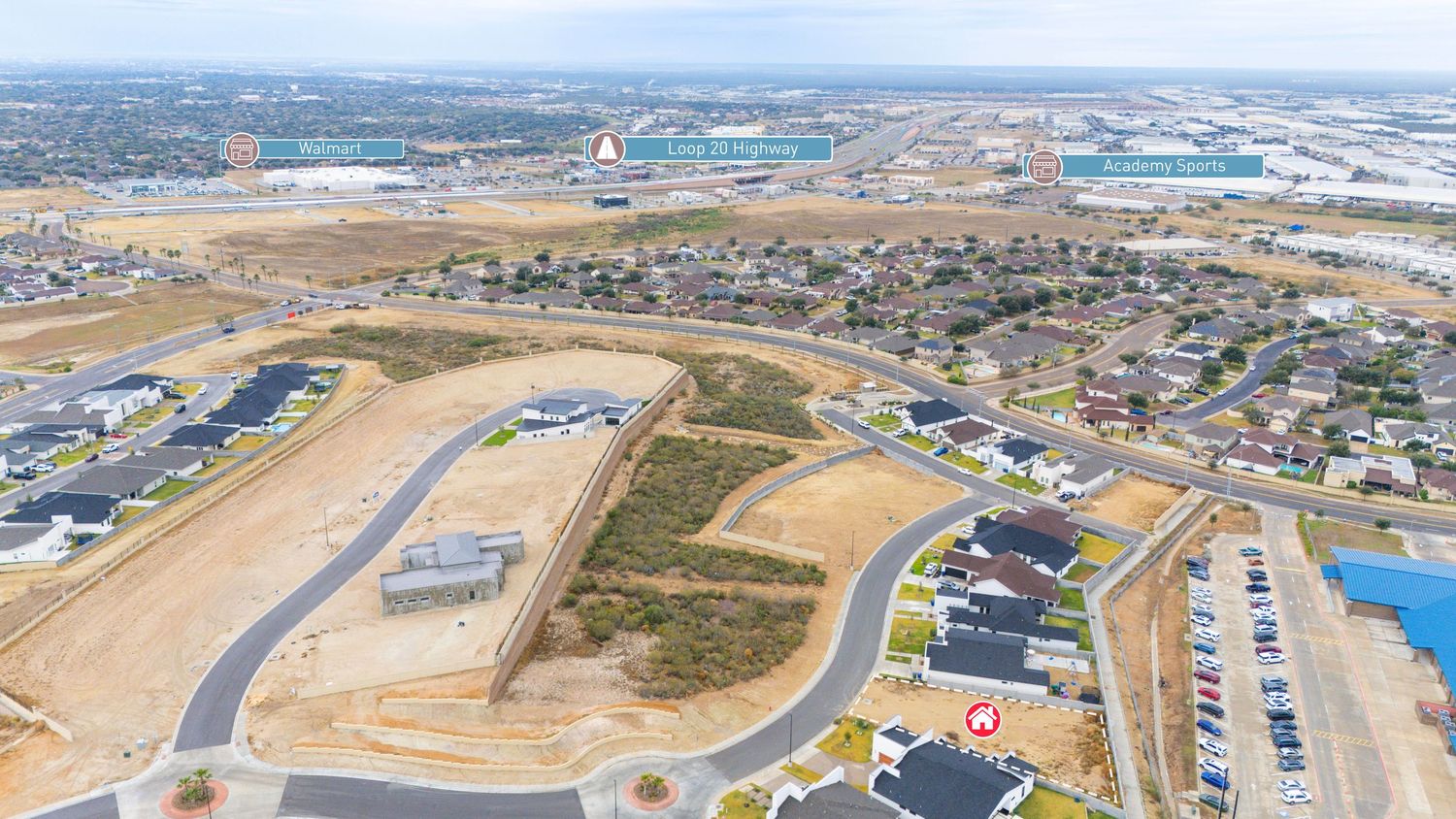 Aerial panoramic view of an airport runway with surrounding urban development and infrastructure in the distance.