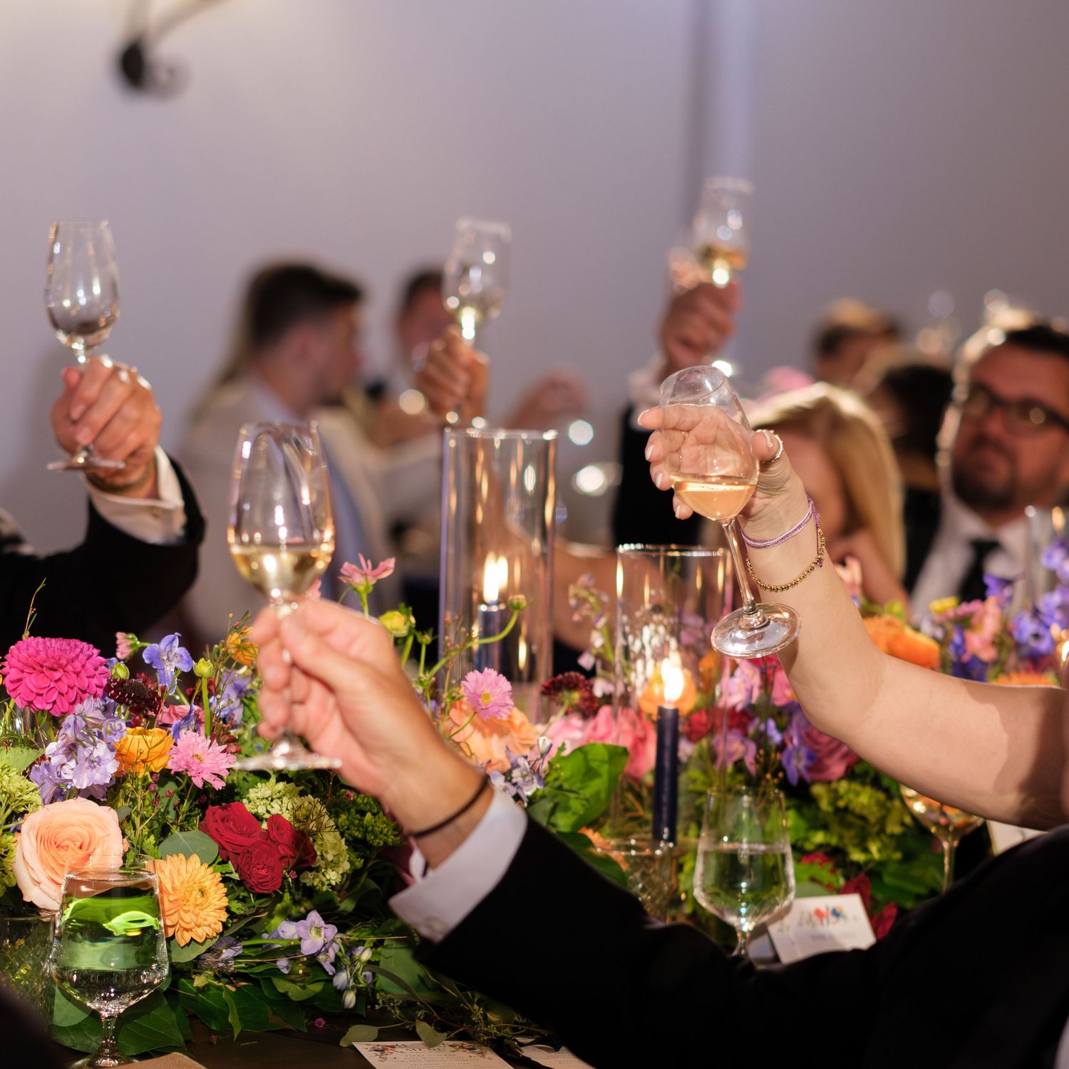 Candid glasses cheering at a Montecito California Wedding.