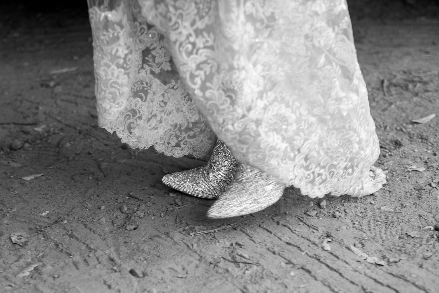 Candid bridal photography. Her sparkly boots shimmy along her wedding at Cold Springs Tavern.