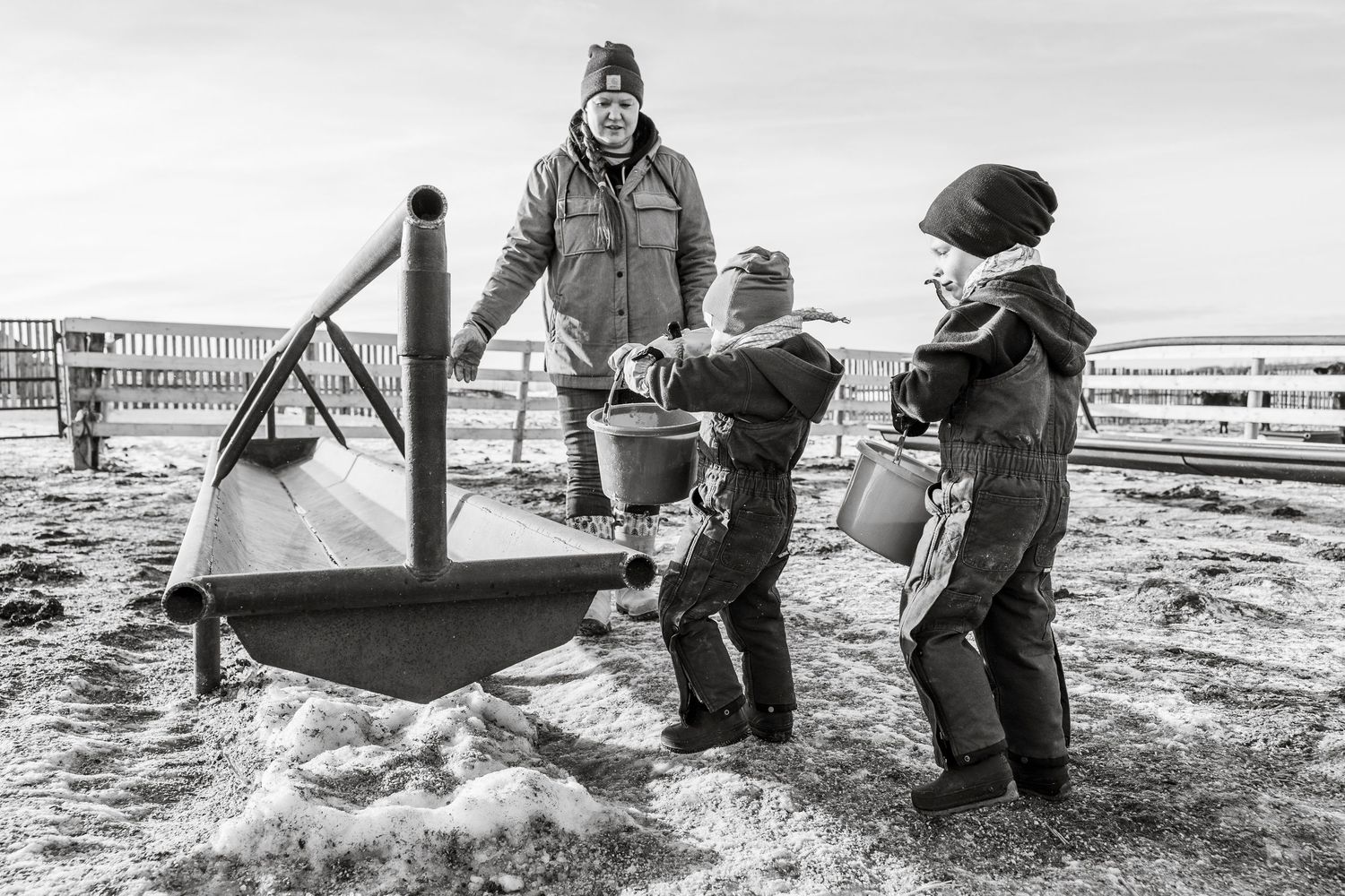 lifestyle session, candid photos, Saskatchewan farm kid, prairie photographer, sask photographer, winter photos, cattle family, chores, ag