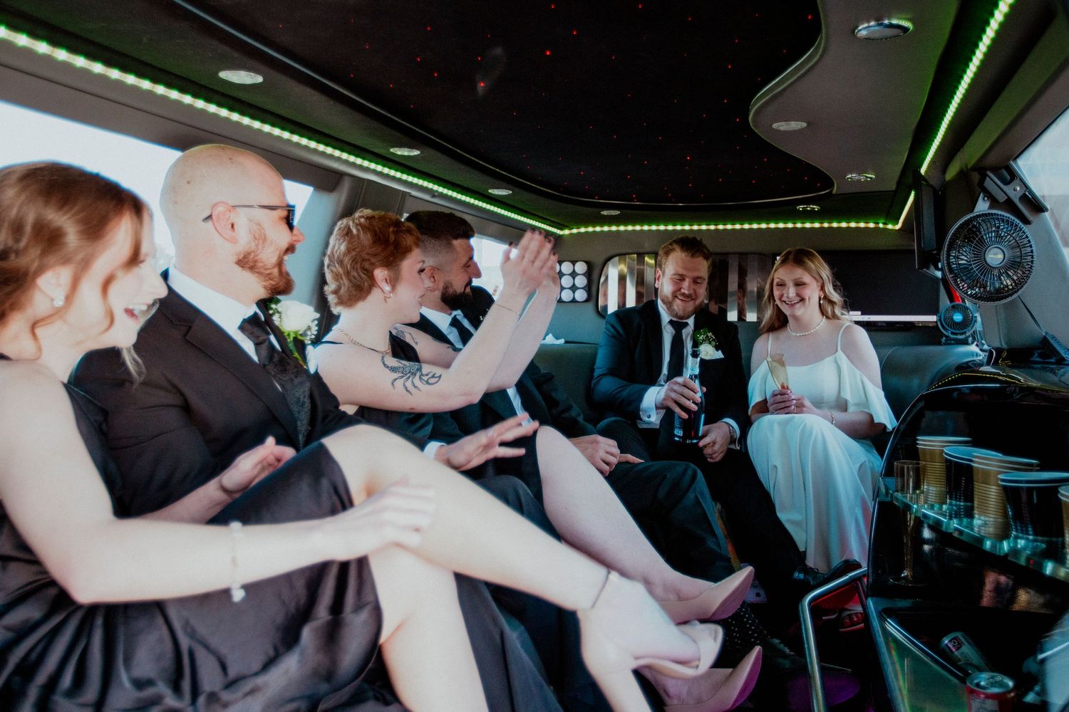wedding photographer, wedding party photos, candid wedding photos, limo photos, limo lights, limo wedding party