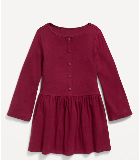 A burgundy baby peplum top with long sleeves and button details on the front.